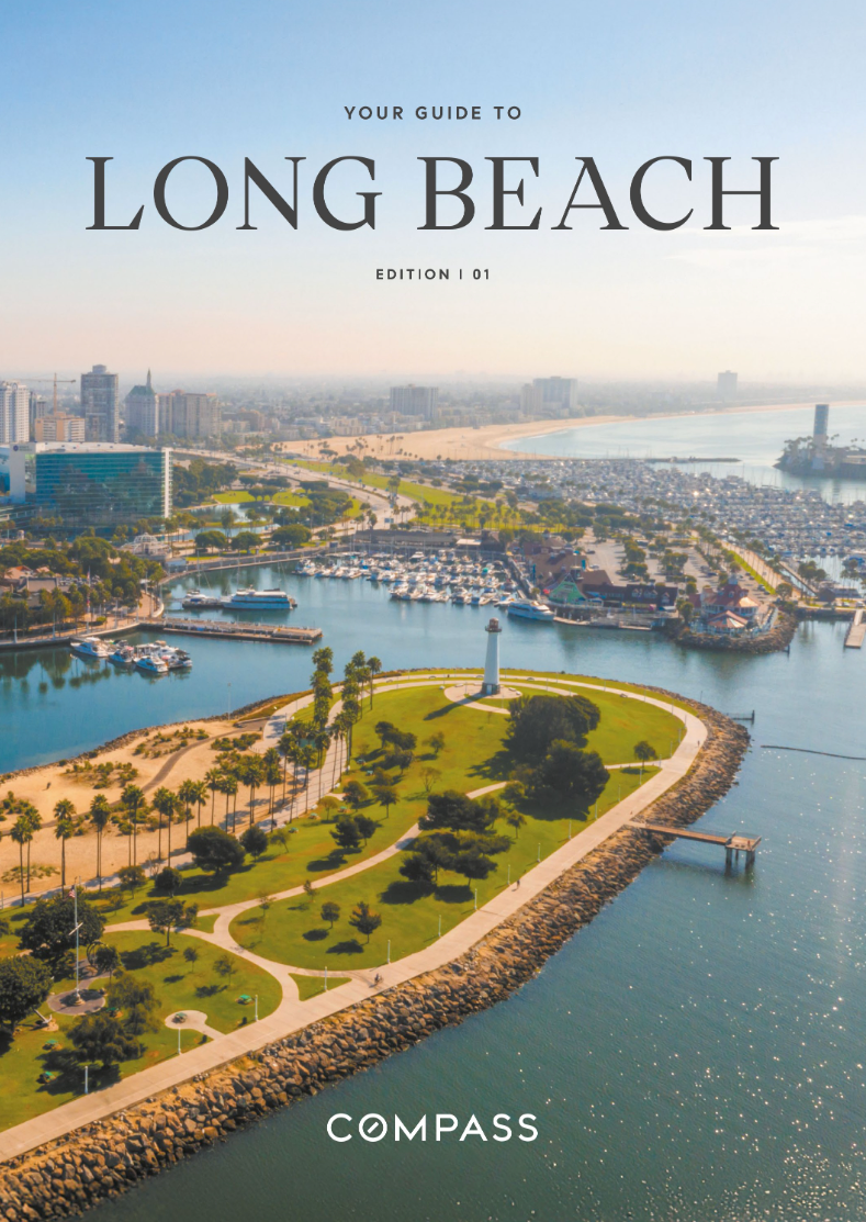 Aerial view of Long Beach harbor with a lighthouse, green park, marina, and city skyline in the background during daytime from the cover of compass realty's guided luxury lifestyle magazine in which morehouse crafted interiors is a partner