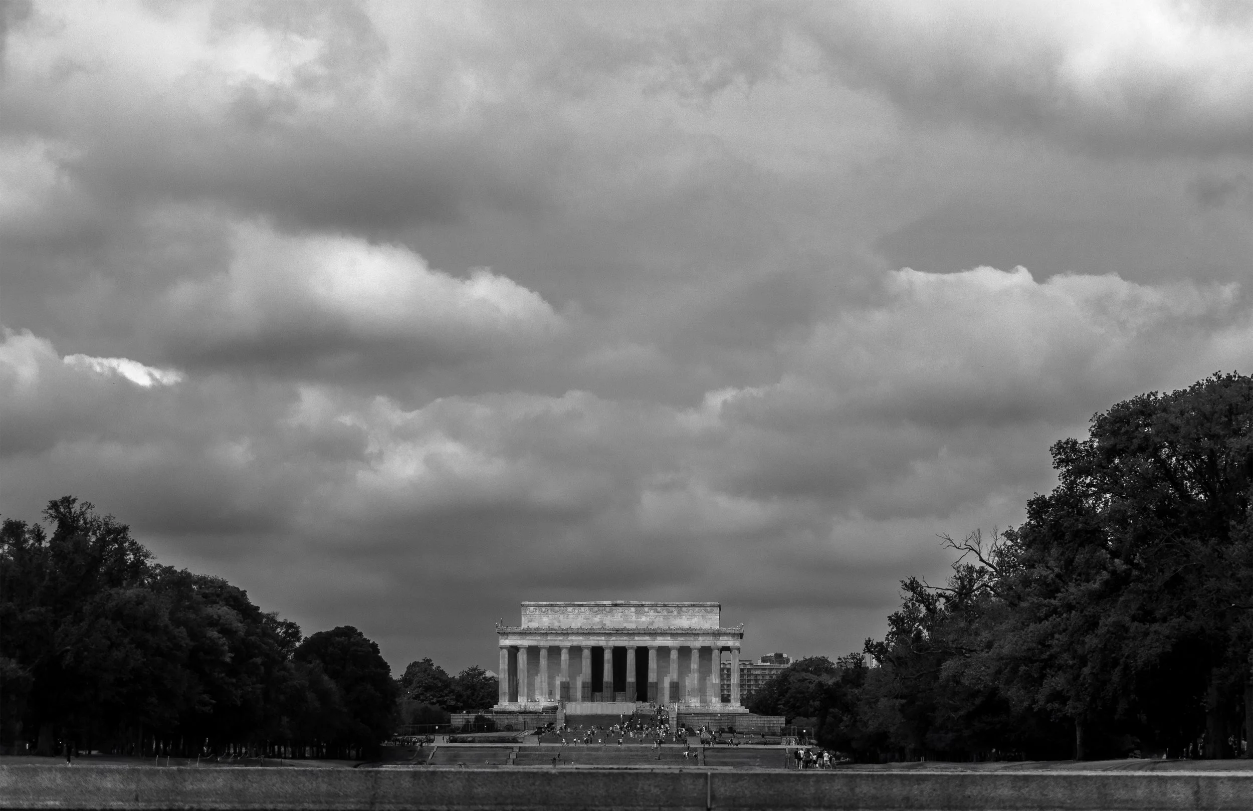 Lincoln Memorial in Washington DC featuring neoclassical architecture with columned facade under dramatic sky