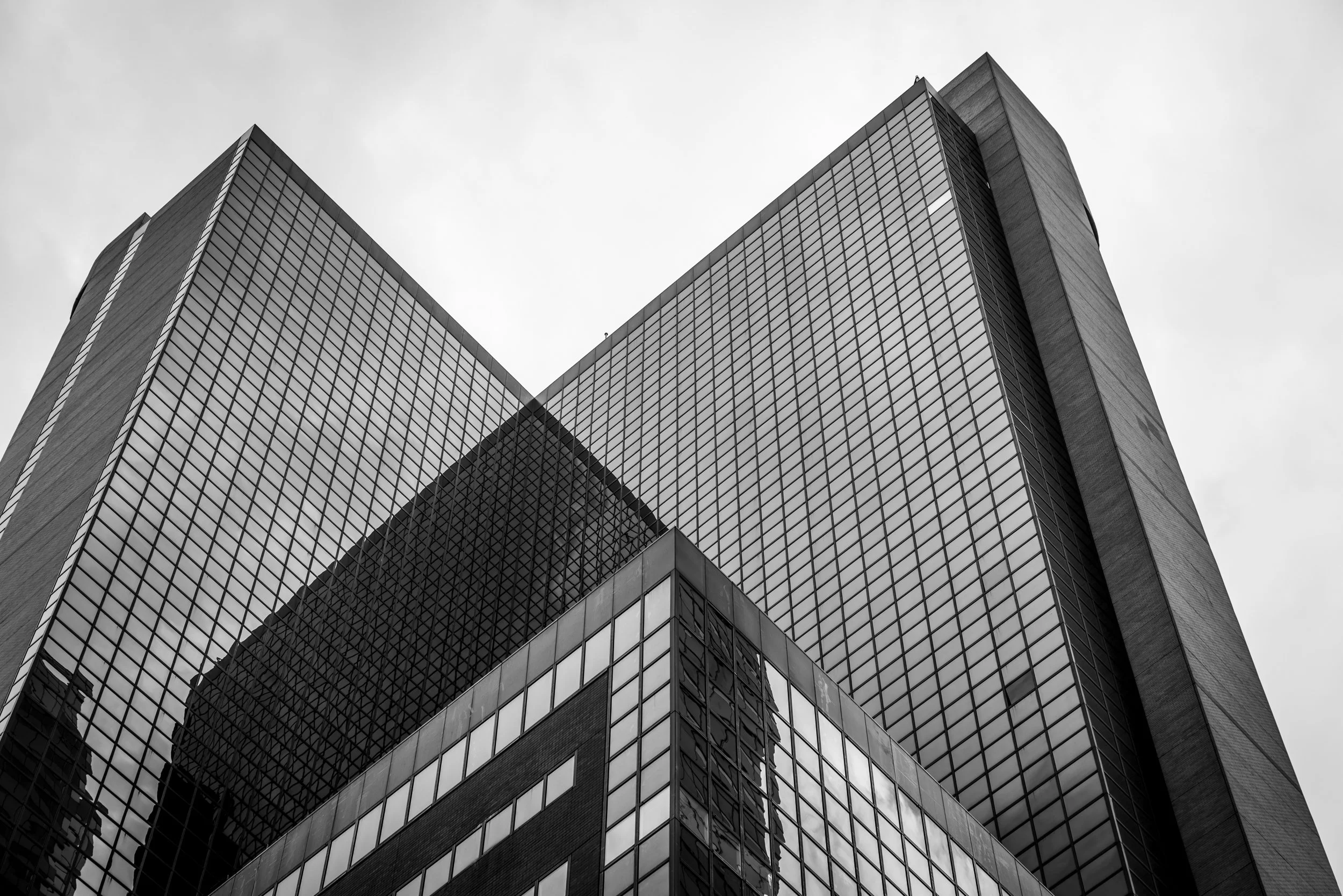 Modern glass facade office building in Manhattan NYC showcasing grid structure and corporate architecture