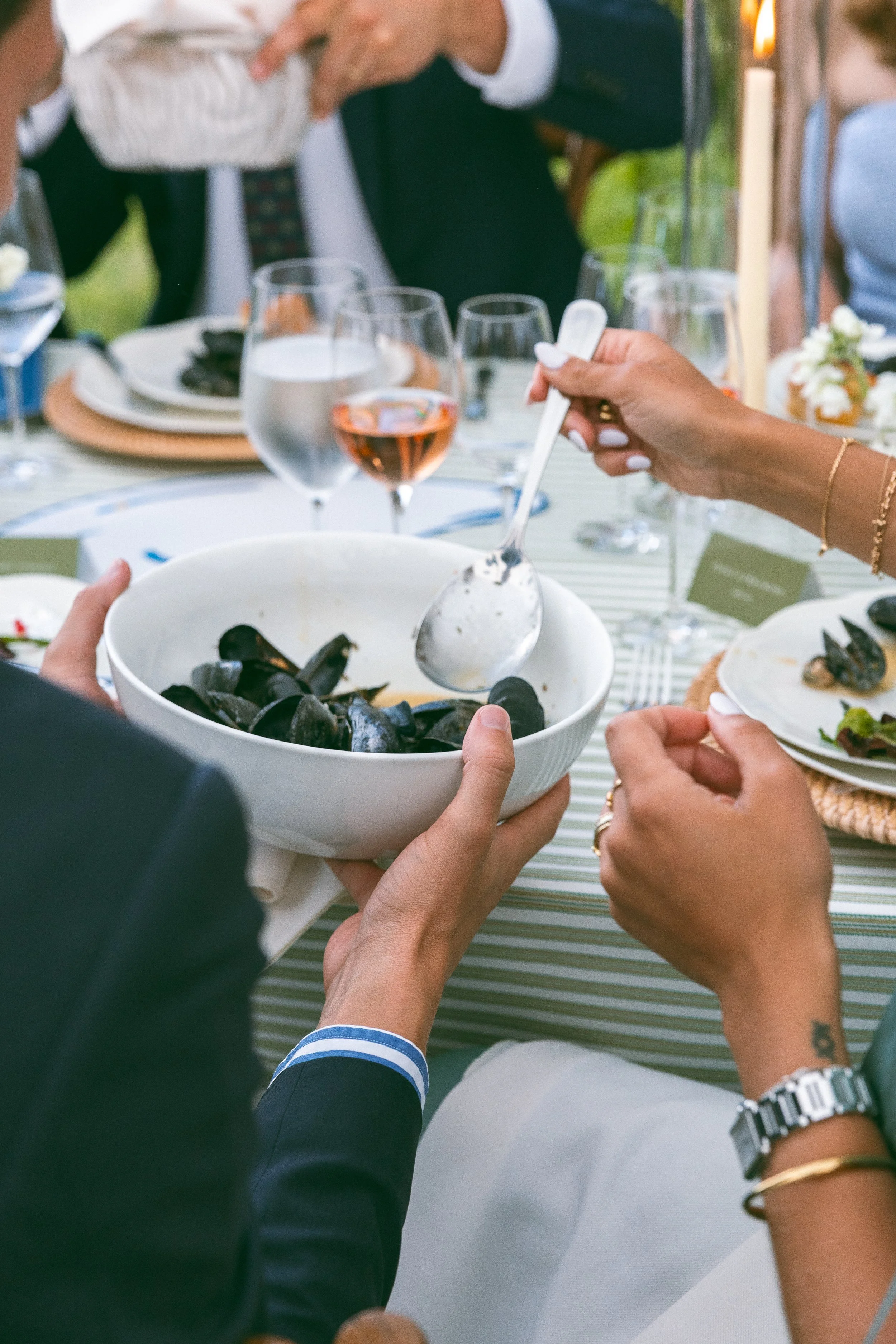 Mussels course during family-style dinner service