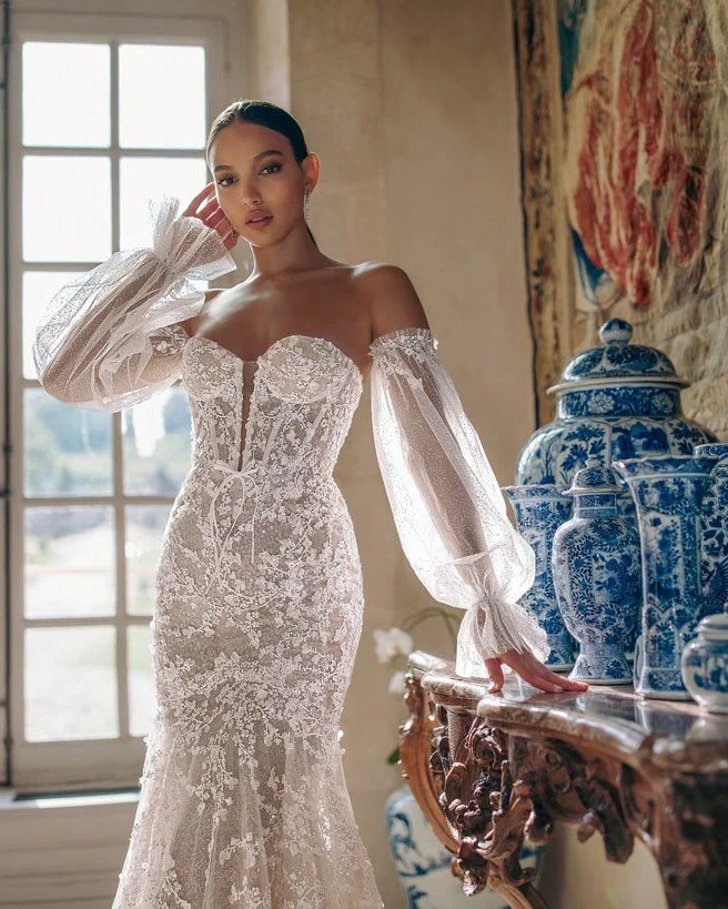 New gown alert: Arwen by Wona! Featuring 3D floral lace, a structured corset, and a stunning fit-and-flare silhouette with a cathedral train. Finished with detachable sheer lantern sleeves for an extra moment.

#SayYesToTheDress #New #princetonbridal