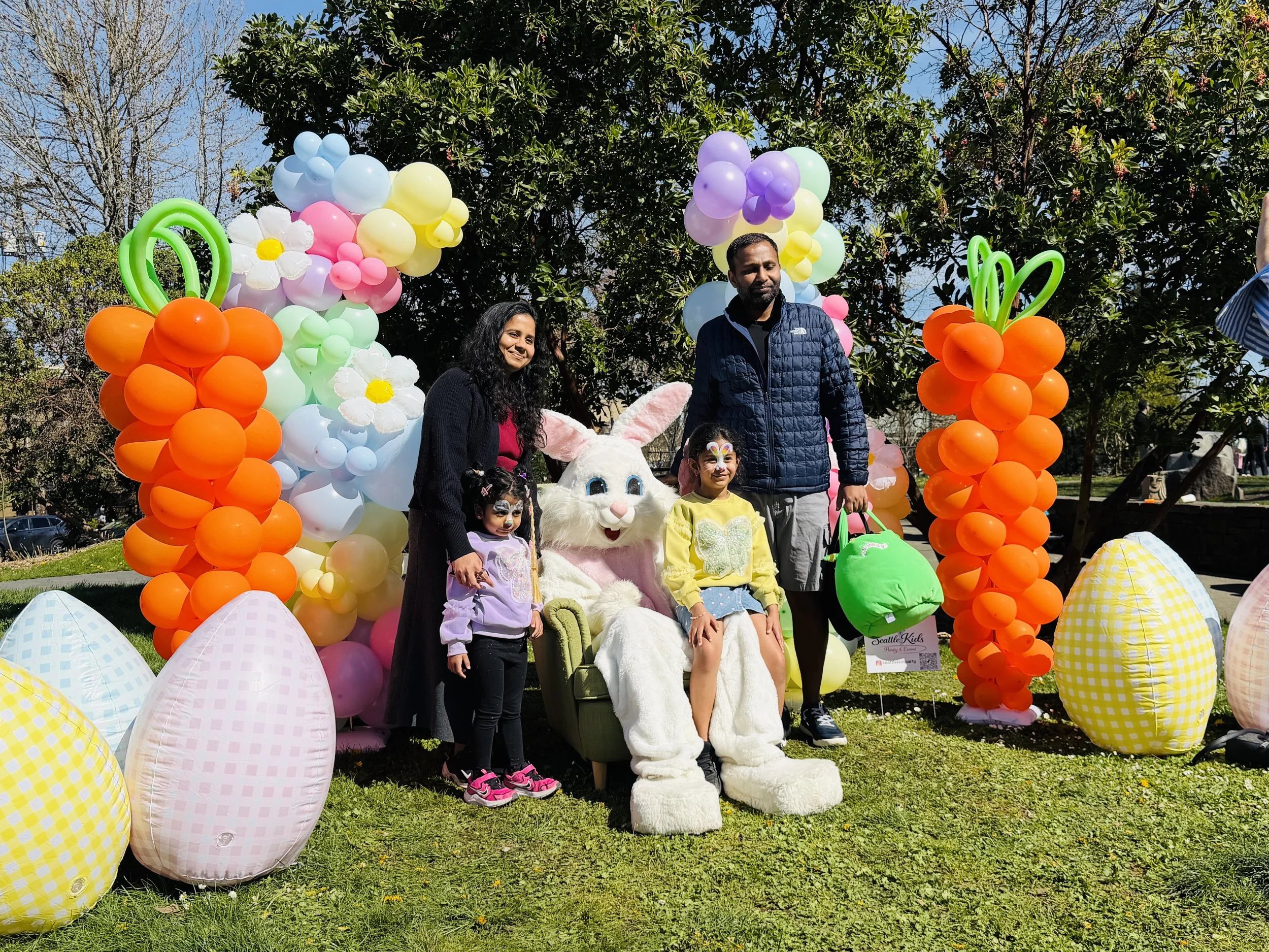 family with easter bunny and balloon decorations in madison park