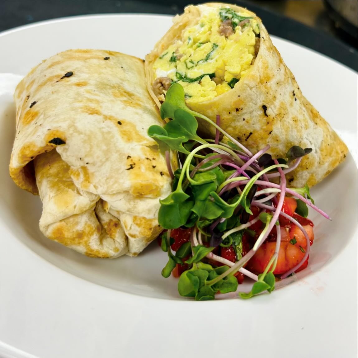 Farmers Market brunch special: breakfast burrito stuffed with eggs florentine, sausage, goat cheese and grilled spring onions. Strawberry-serrano salsa on the side is sweet &amp; a lil spicy just like our brunch chef Sammie. 🍓🌶️ Locally made, local