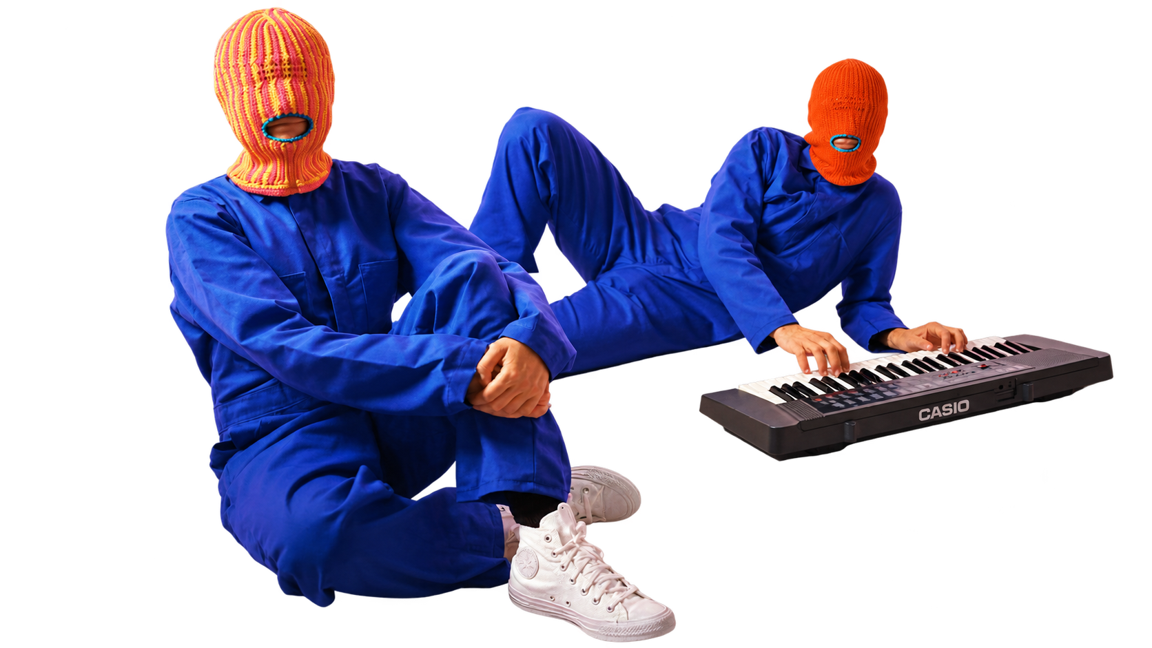 Two Brother Mouth figures wearing colorful Mouth-Clavas and blue outfits beside a keyboard.