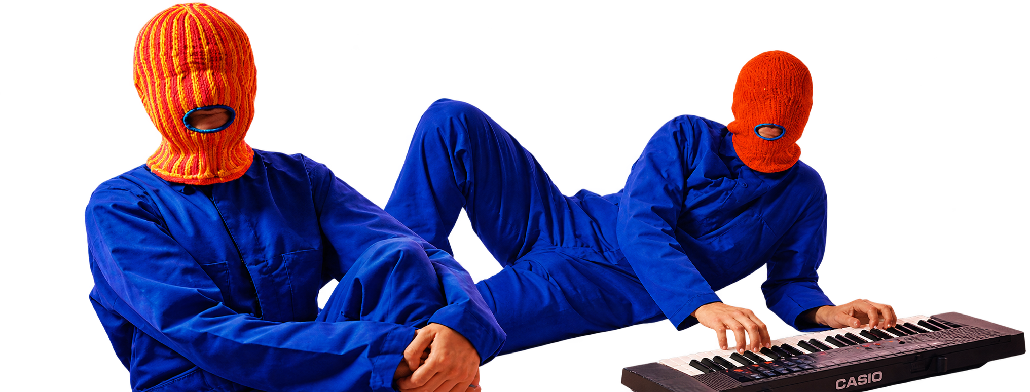 Two Brother Mouth figures wearing colorful Mouth-Clavas and blue outfits beside a keyboard.