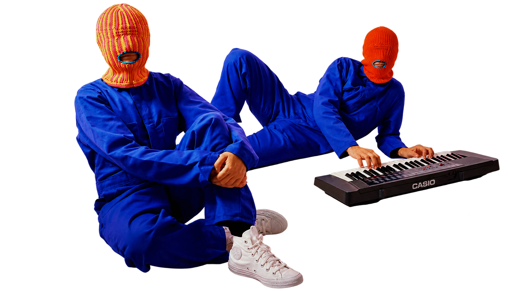 Two Brother Mouth figures wearing colorful Mouth-Clavas and blue outfits beside a keyboard.