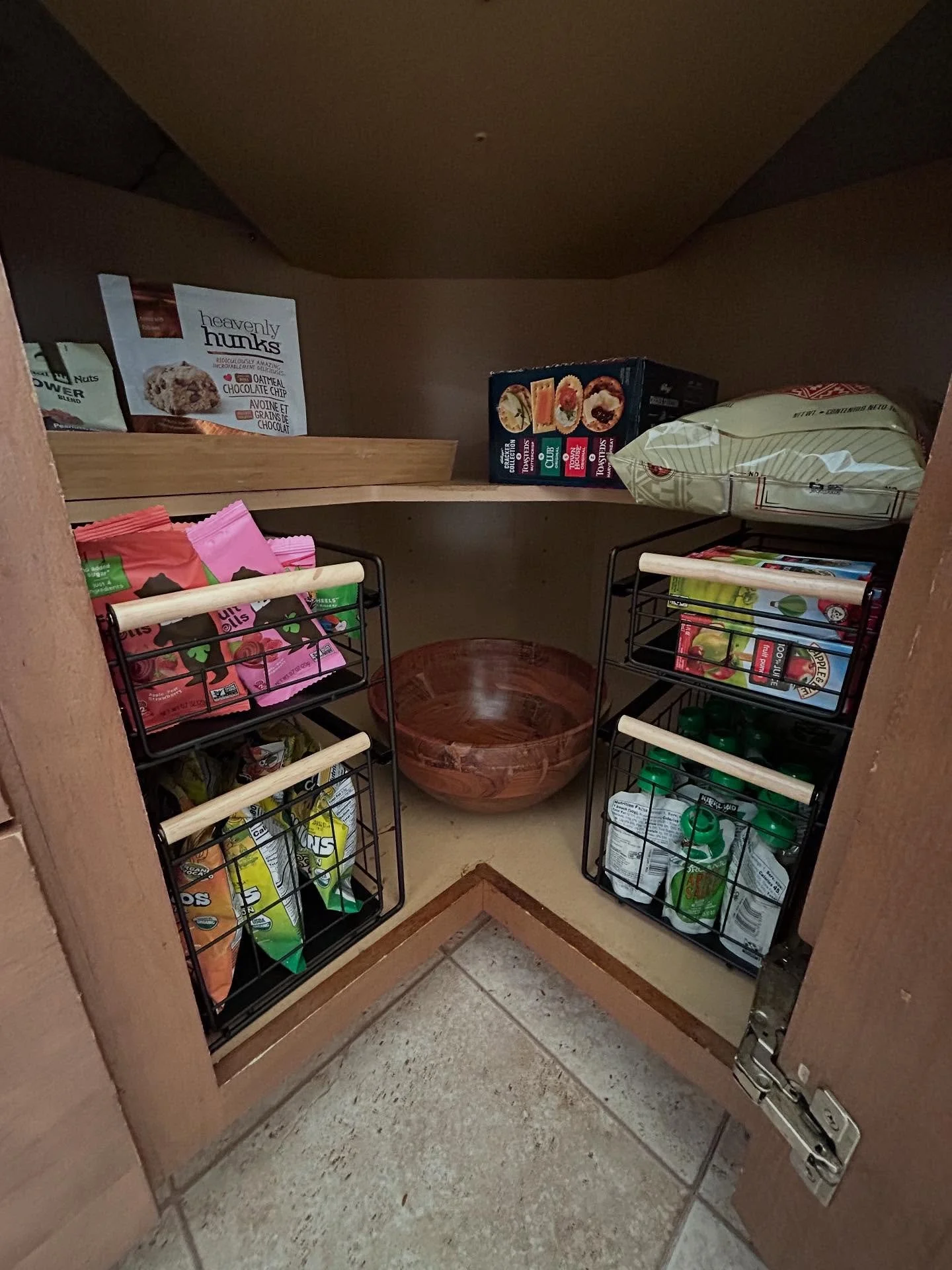 Swipe to see the before photo of this kids snack cabinet! Creating an accessible snack area for your kids is a great way to encourage independent snacking. The pull out drawers utilize the depth of this cabinet and leaving extra room for back-stock o