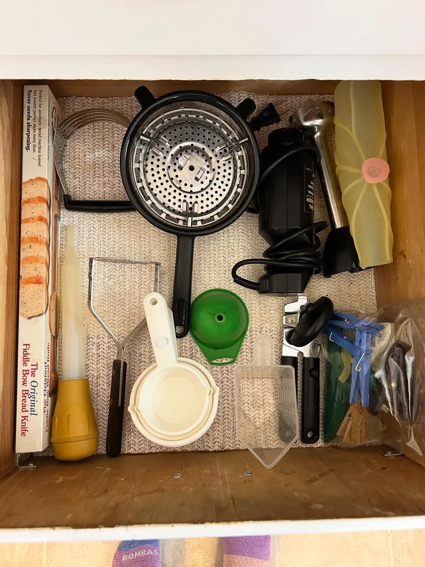 Last week we had 15 extra minutes at the end of a session and I asked if she had a drawer in the kitchen (which we are tackling next) that stressed her out the most. She quickly said yes and pointed to this one!

This was a quick declutter with a big
