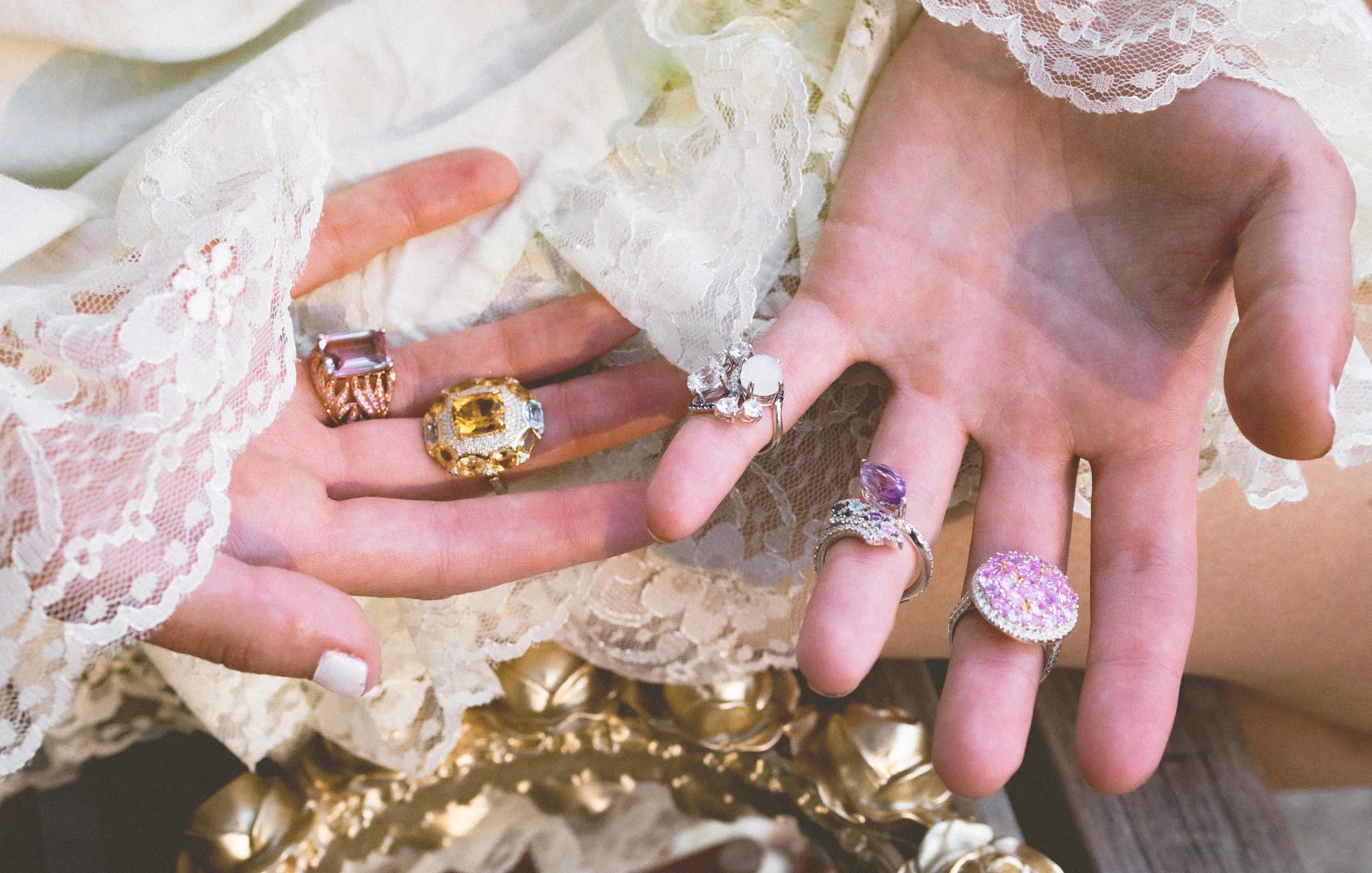 Model's hands featuring high jewelry rings from the In Your Dreams collection by Gerard Rene, a private NYC atelier.