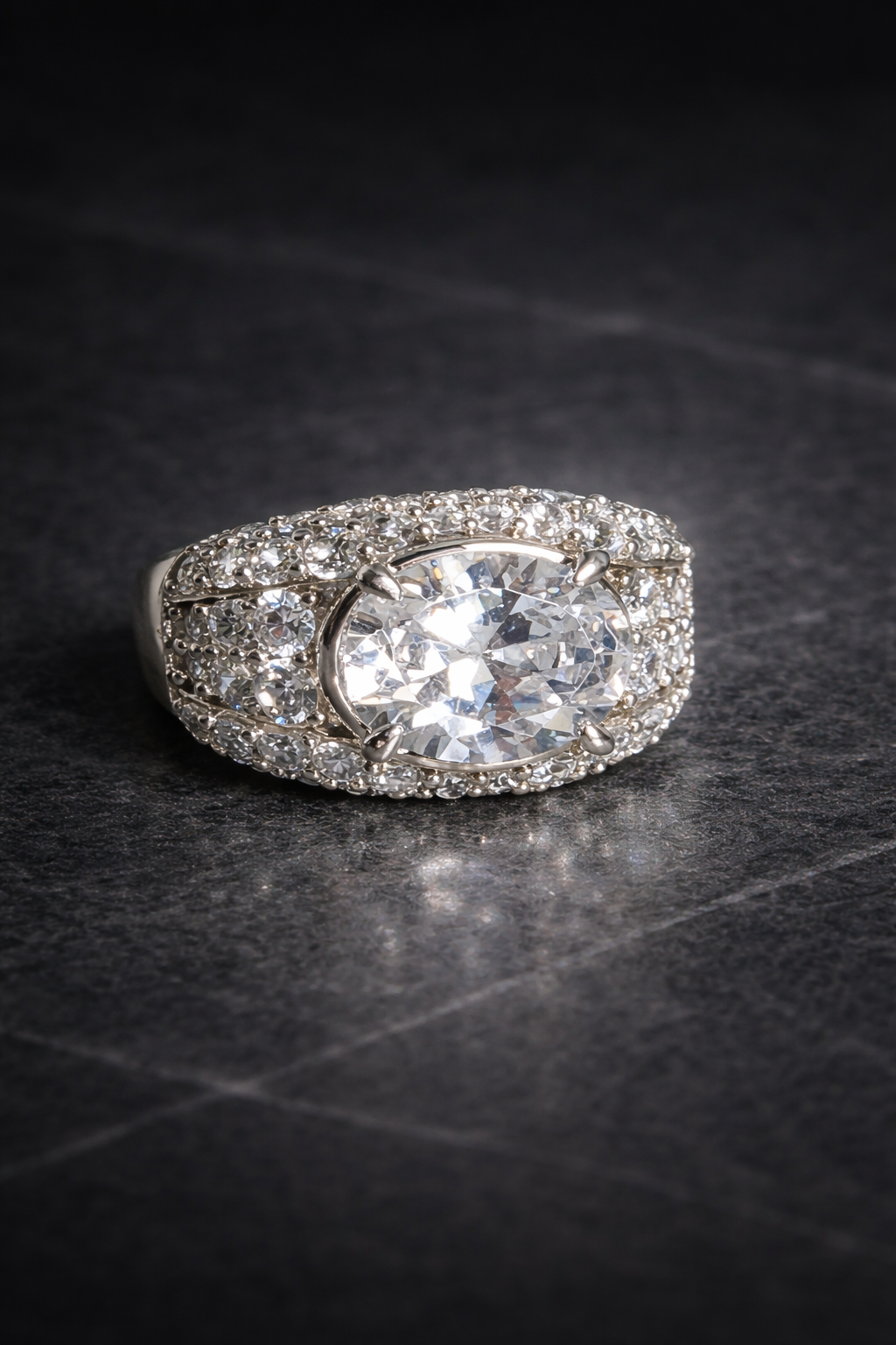 Gerard Rene Private Commissions: An architectural signature featuring an oval-cut diamond and high-density pavé. A bespoke legacy artifact.