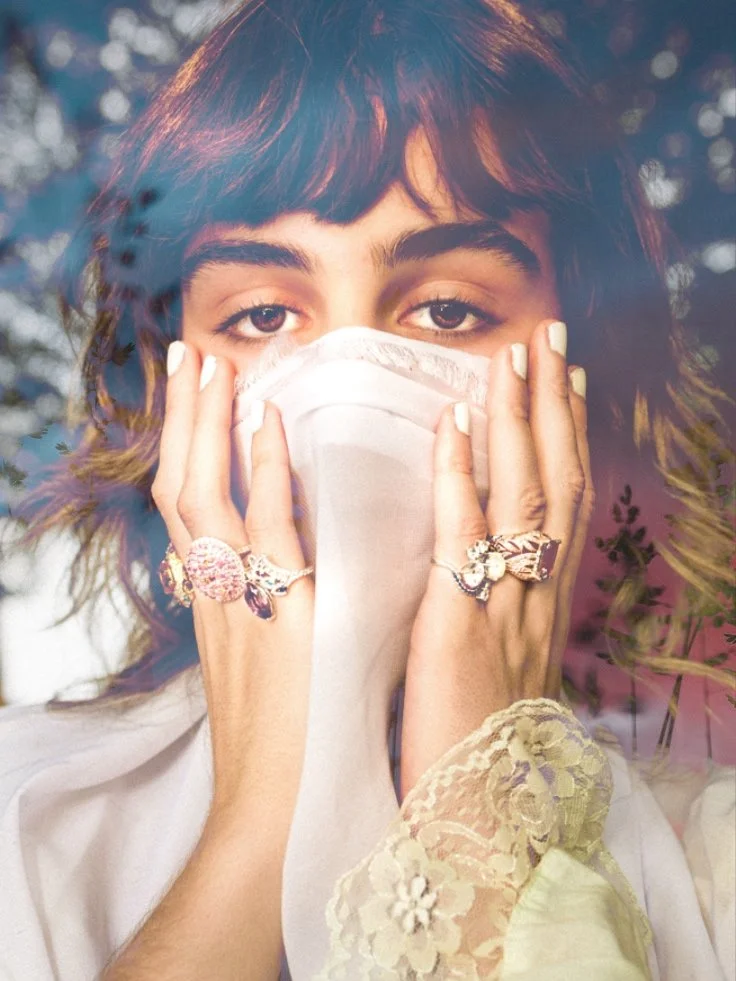 Model's hands featuring high jewelry rings from the In Your Dreams collection by Gerard Rene, a private NYC atelier.