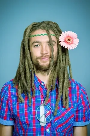 22241241-portrait-of-a-hippie-young-man-with-a-flower.webp
