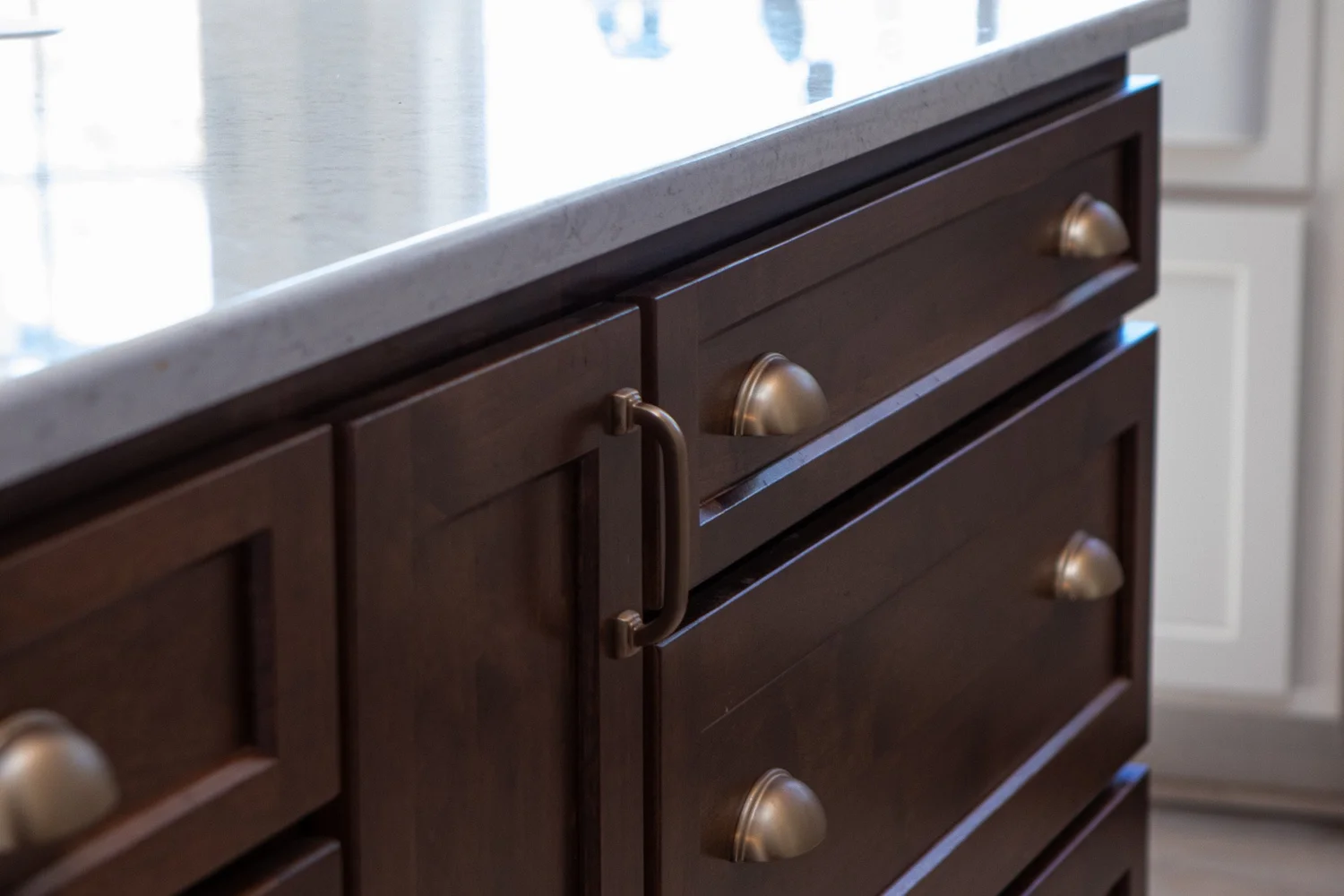 Wood cabinet drawers with brass knobs