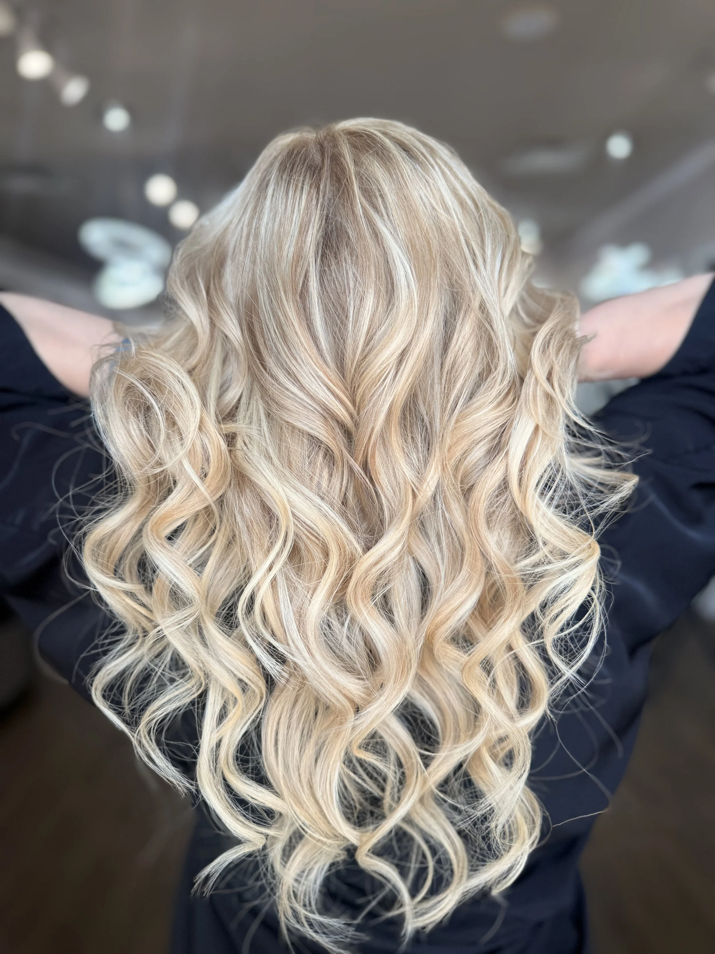 Before and after hair extension transformation, adding length, volume, and seamless blending for fuller, longer hair at Pani Style Hair Salon, Katy, TX.