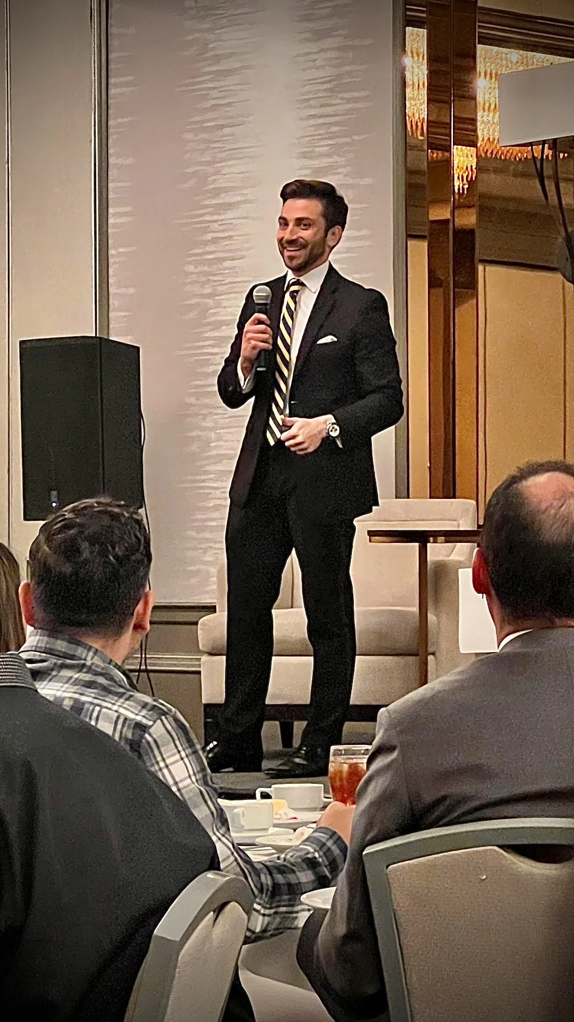 Dr. James Roldan speaking at a U.S.–Brazilian ADHONEP business meeting in Boca Raton, Florida.