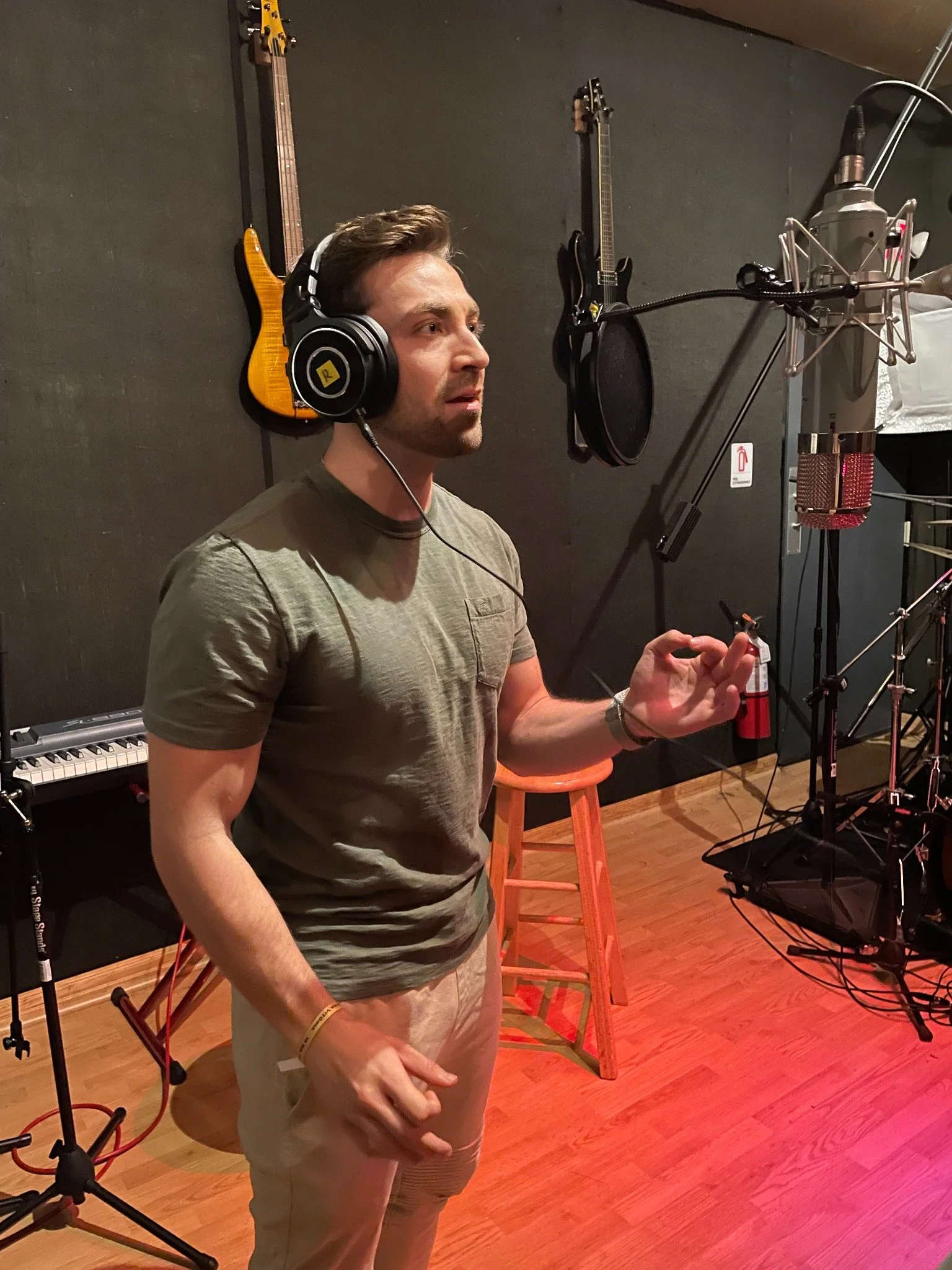 Dr. James Roldan recording music in a professional studio.