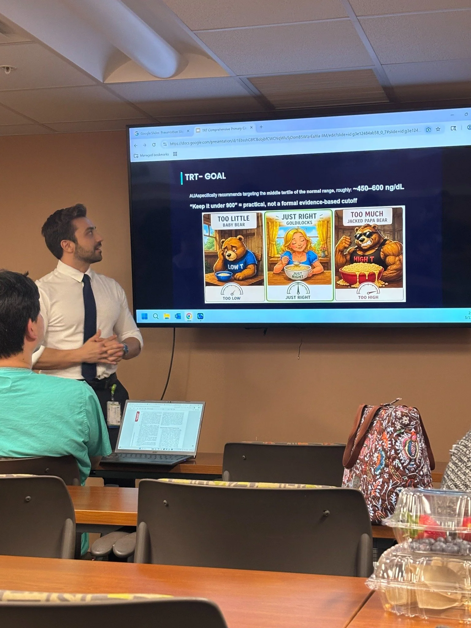 Dr. James Roldan presenting a testosterone-replacement therapy lecture to fellow residents.