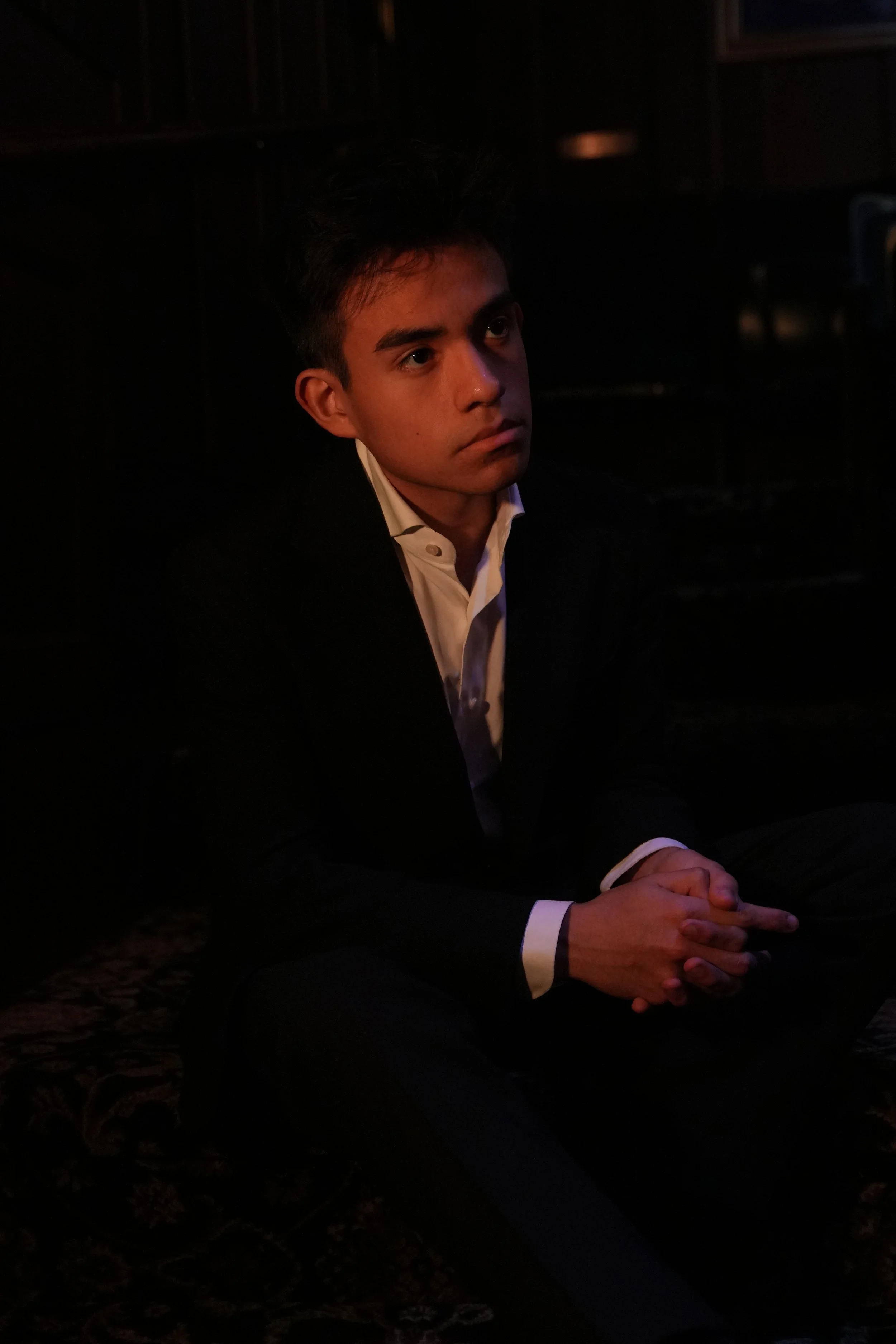 Jacob Martinez, Los Angeles magician and mentalist, performing close-up magic at a private event