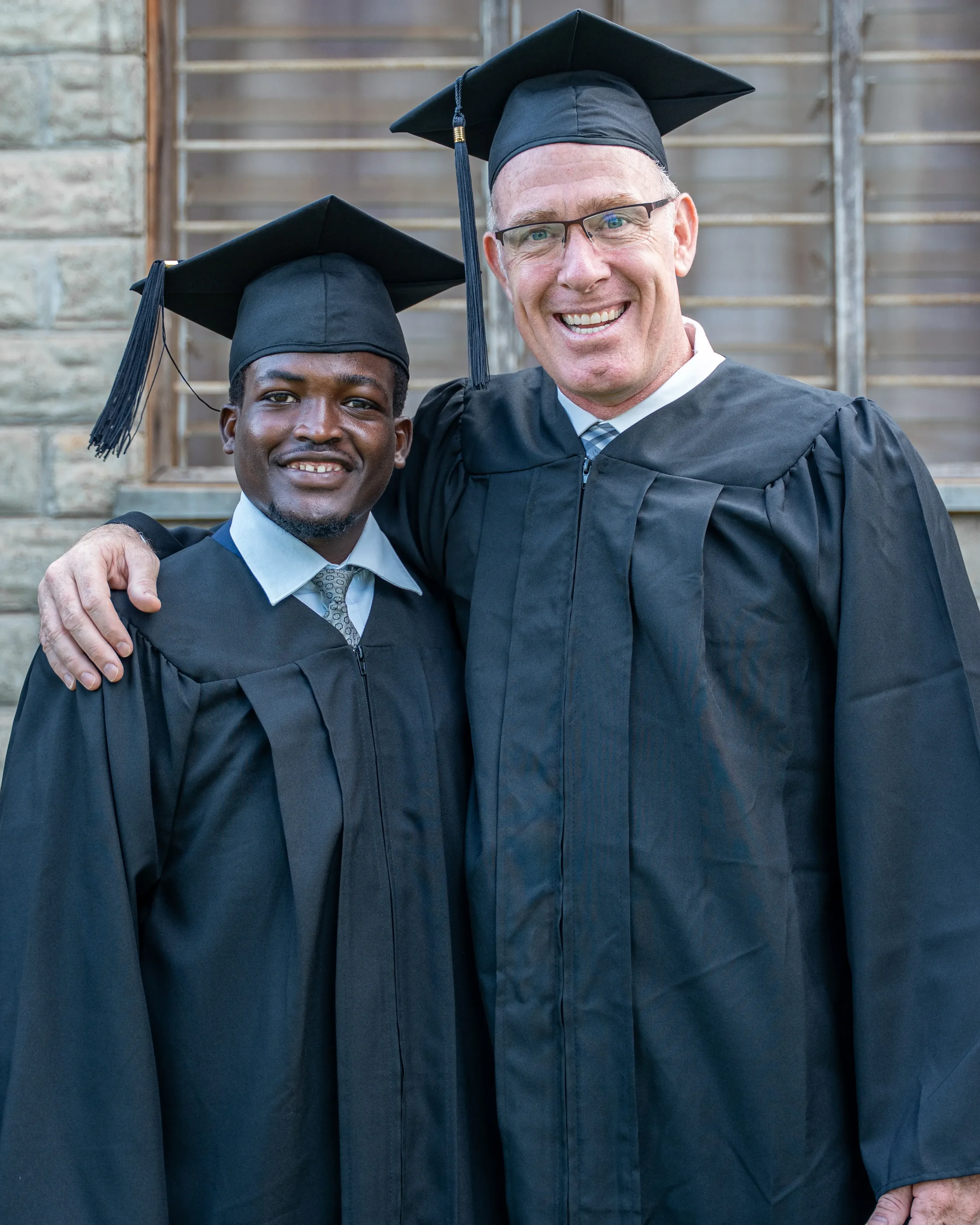 Founder and CEO, Shannon Hurley pose for photo with one of the graduands.