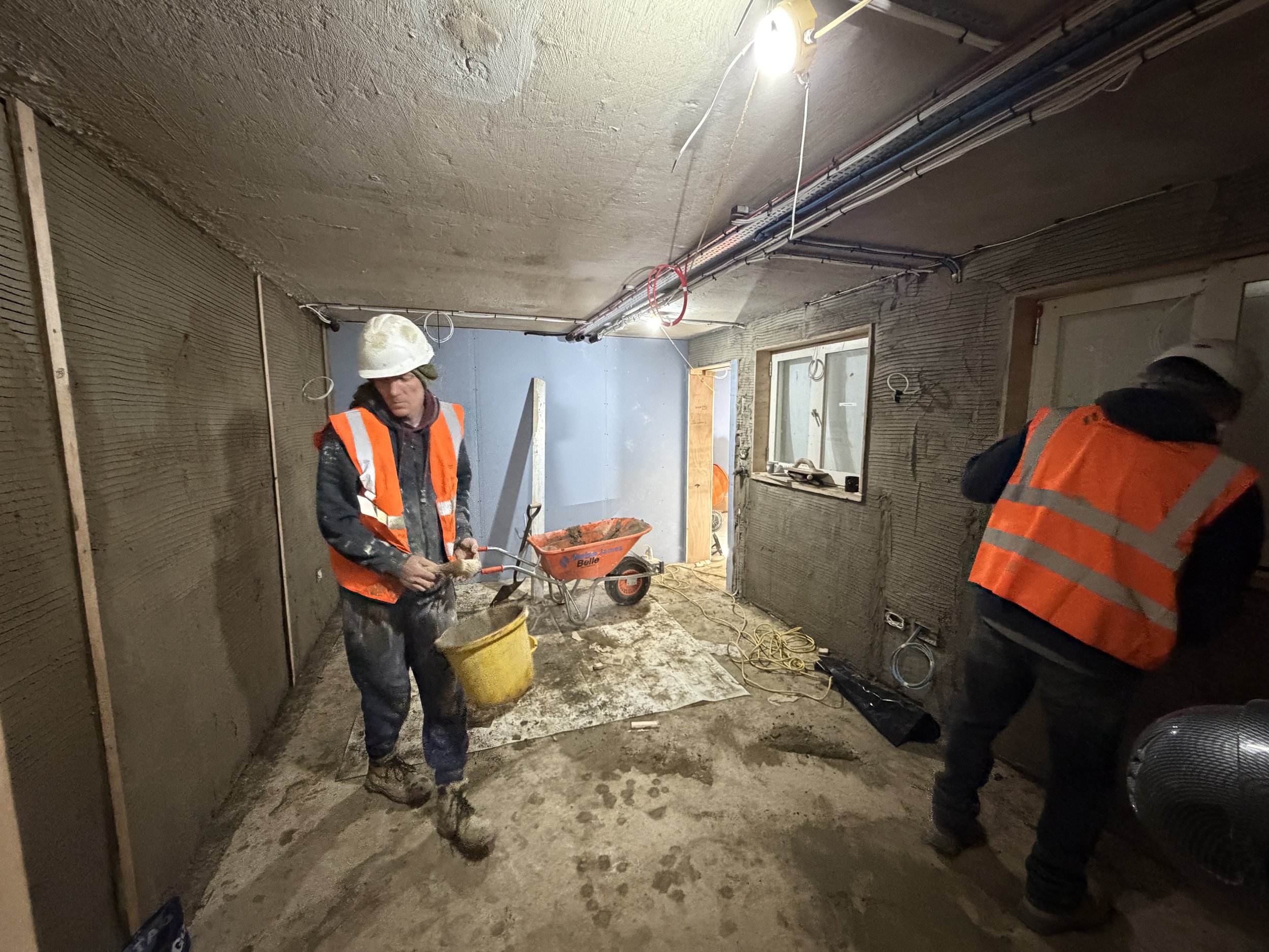 Multi-trade demolition team coordinating controlled strip-out works within the Holland Park W11 listed residential refurbishment.