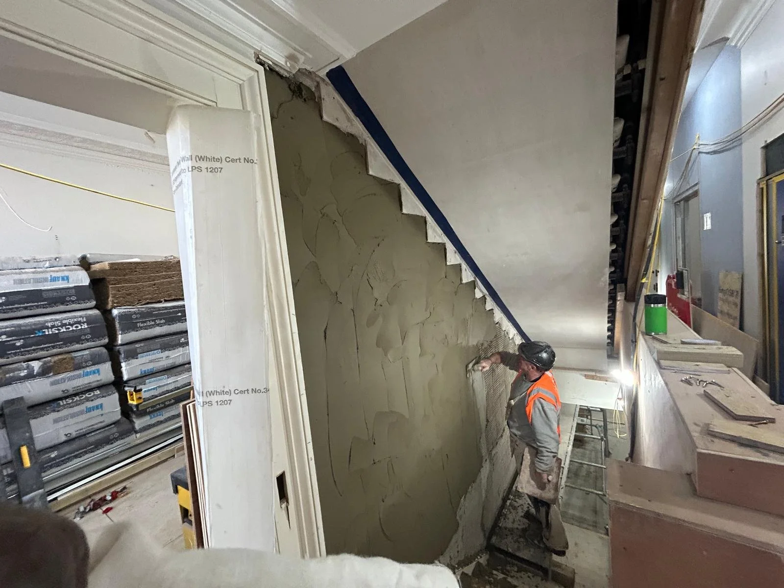 Controlled demolition in progress with operatives working inside the high-end Holland Park W11 residential property.
