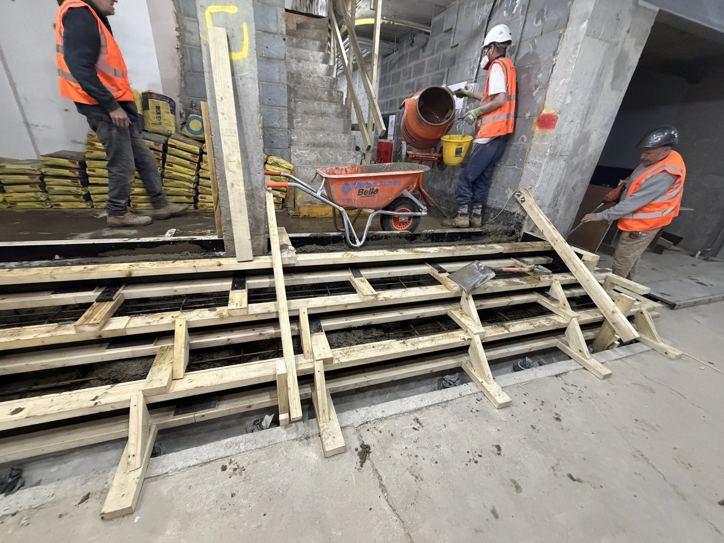 Concrete mixing and placement operations supporting structural builders’ works at Holland Park W11, Central London.
