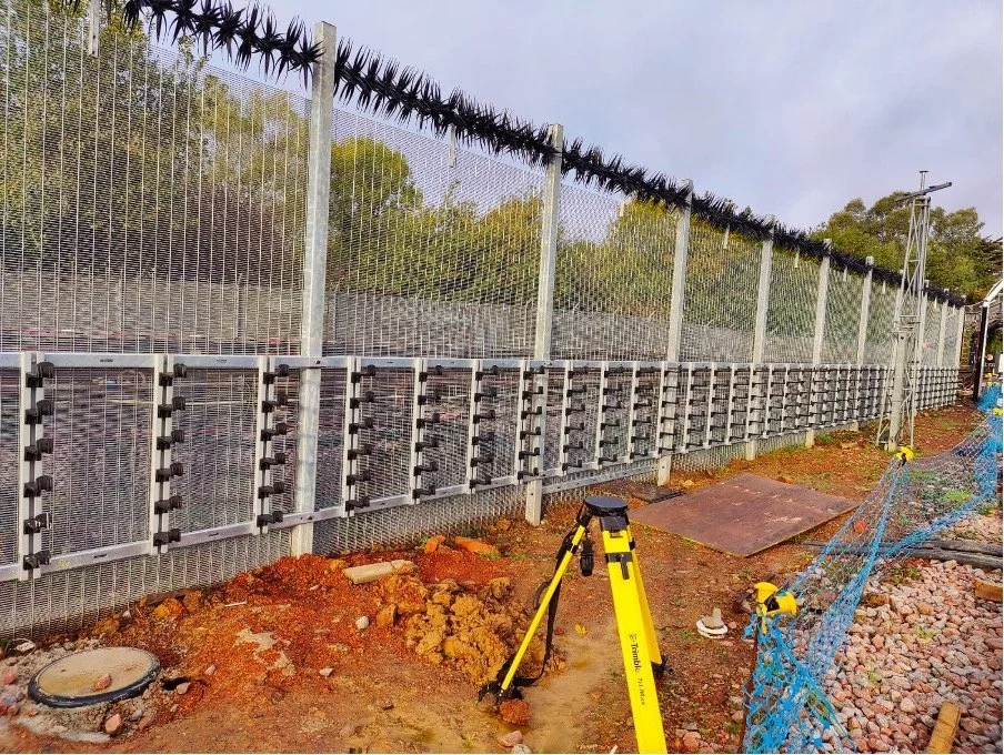 Fencing & Groundworks - Temporary access road and edging kerbs, 358 security fencing topped with barbed wire and vehicle access gates
