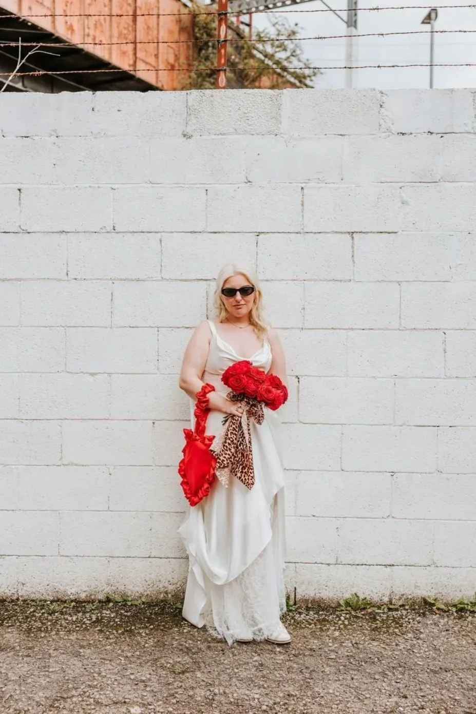 Cool bride with red and pink cartoon style bouquet