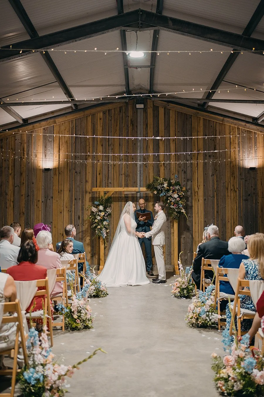Pastel wedding ceremony flowers 