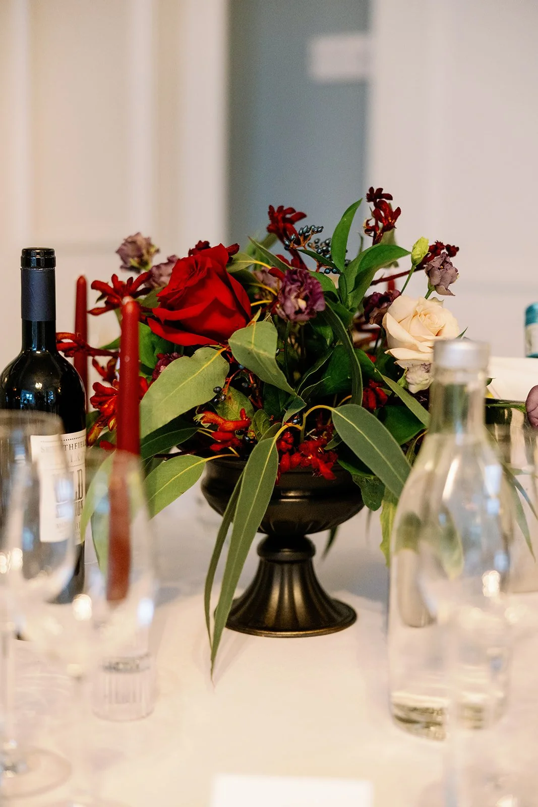 Moody Red table arrangement created by MillieBuds, Stockport