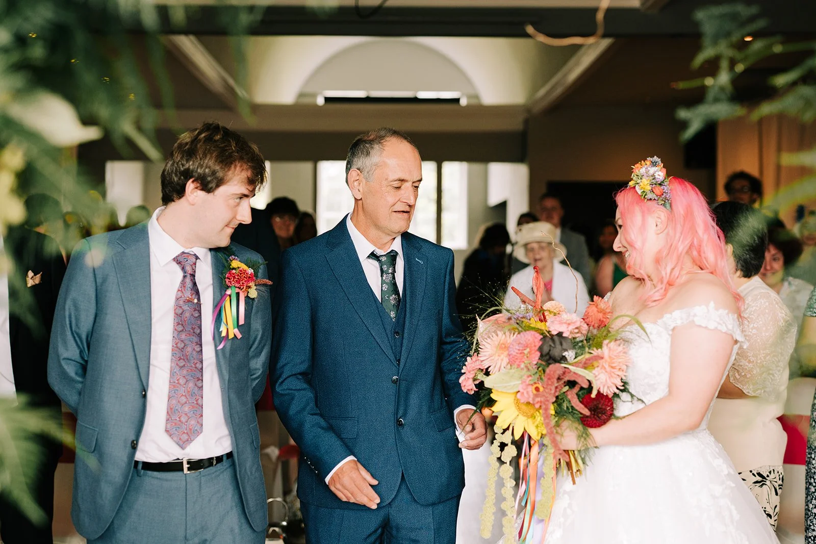 Father giving away bride at colourful wedding created by MillieBuds Colour Loving Wedding Florist in Stockport at Bowdon Rooms