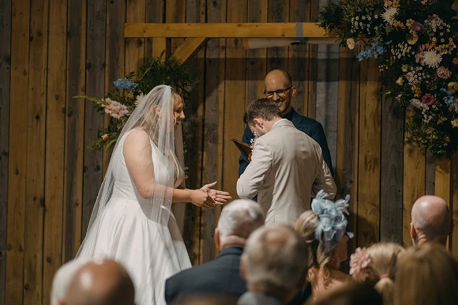 Pastel wedding indoor ceremony wooden arch 