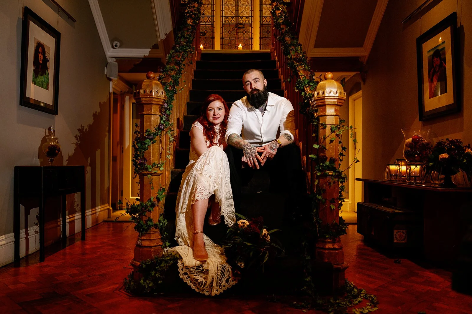 Dar and moody wedding couple on stairs
