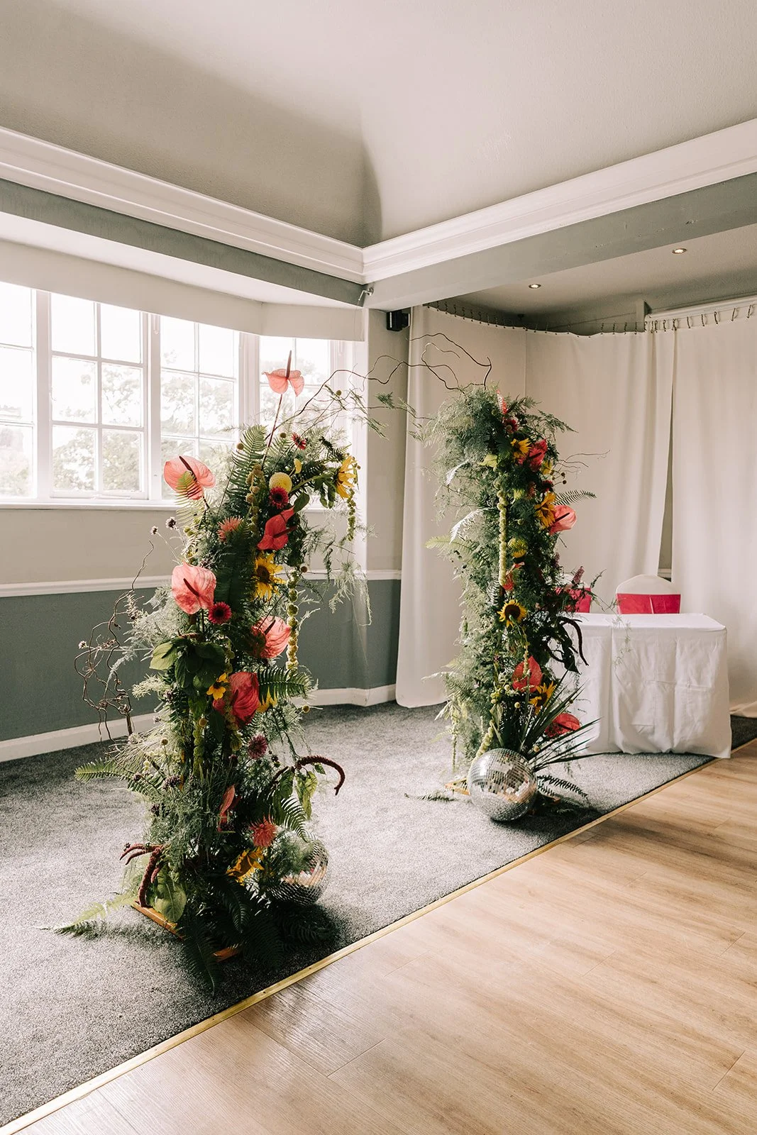 Colourful whimsical split arch created by MillieBuds Colour Loving Wedding Florist in Stockport