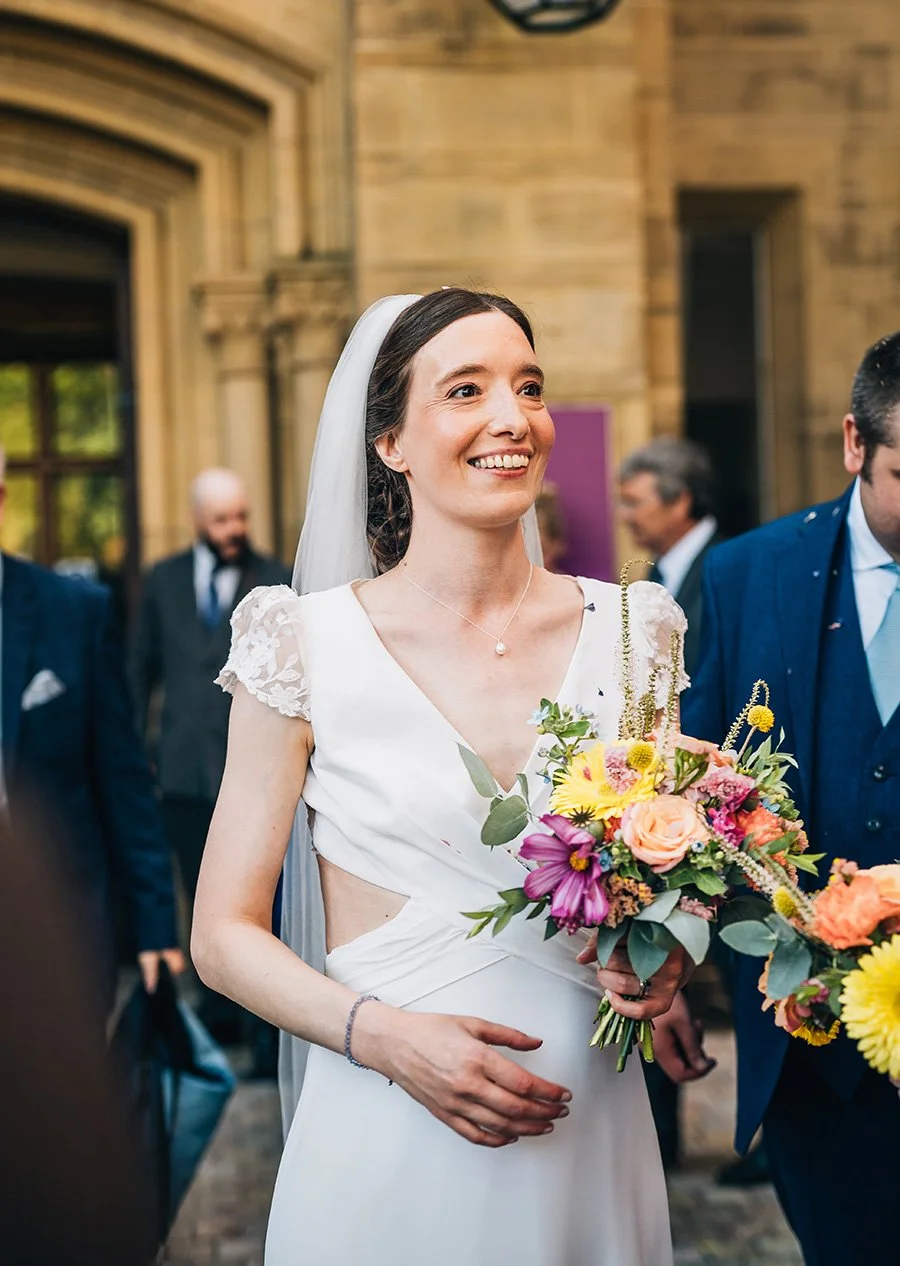 Bride with bride colourful wedding flowers