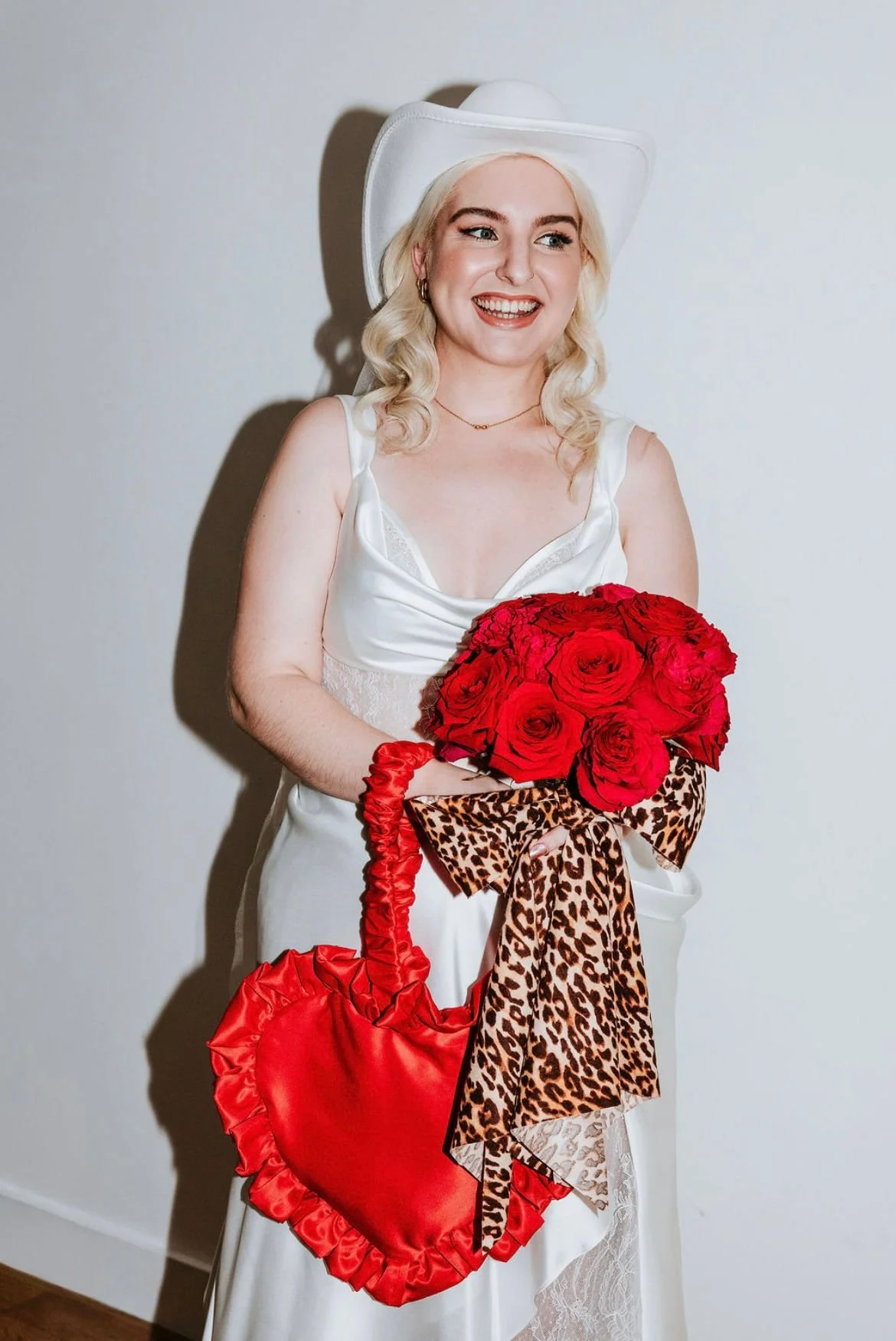 Bright red and pink bouquet with leopard print ribbon