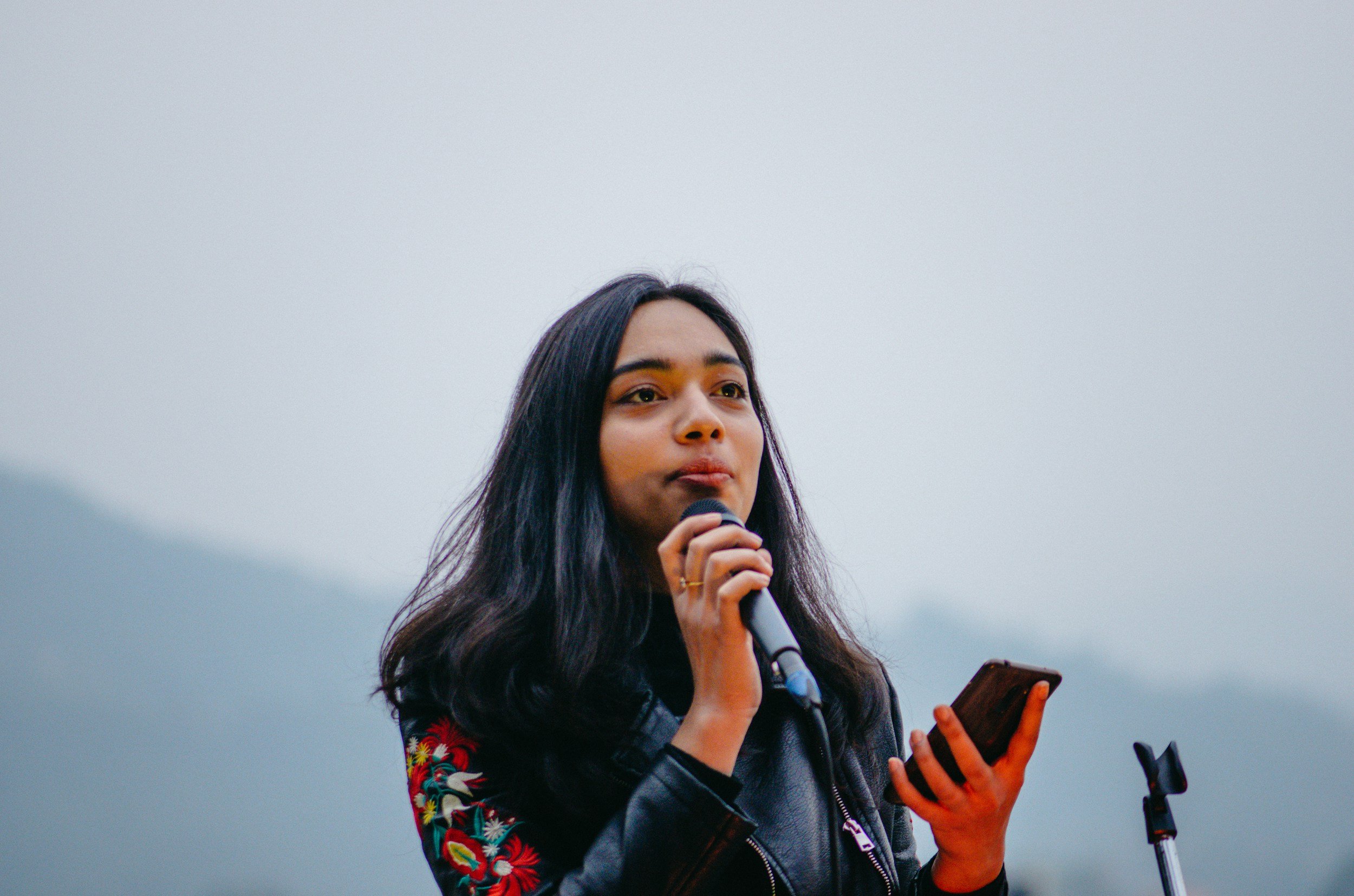 Young woman speaking up with confidence