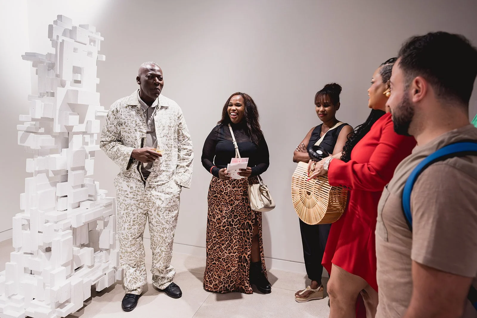 Al Ebanks and guests at the IDG showroom during Cayman Art Week 2026