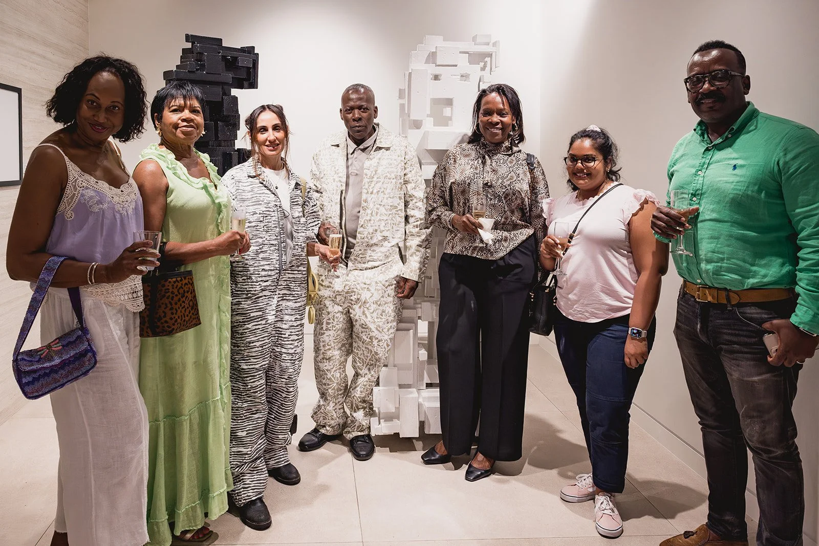 Al Ebanks and guests at the IDG showroom during Cayman Art Week 2026