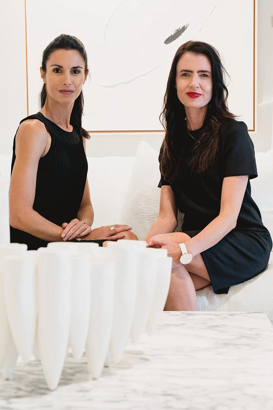 Janine Every and IDG Marketing Director during Cayman Art Week 2026 at IDG's exhibition "Spatial Dialogue"
