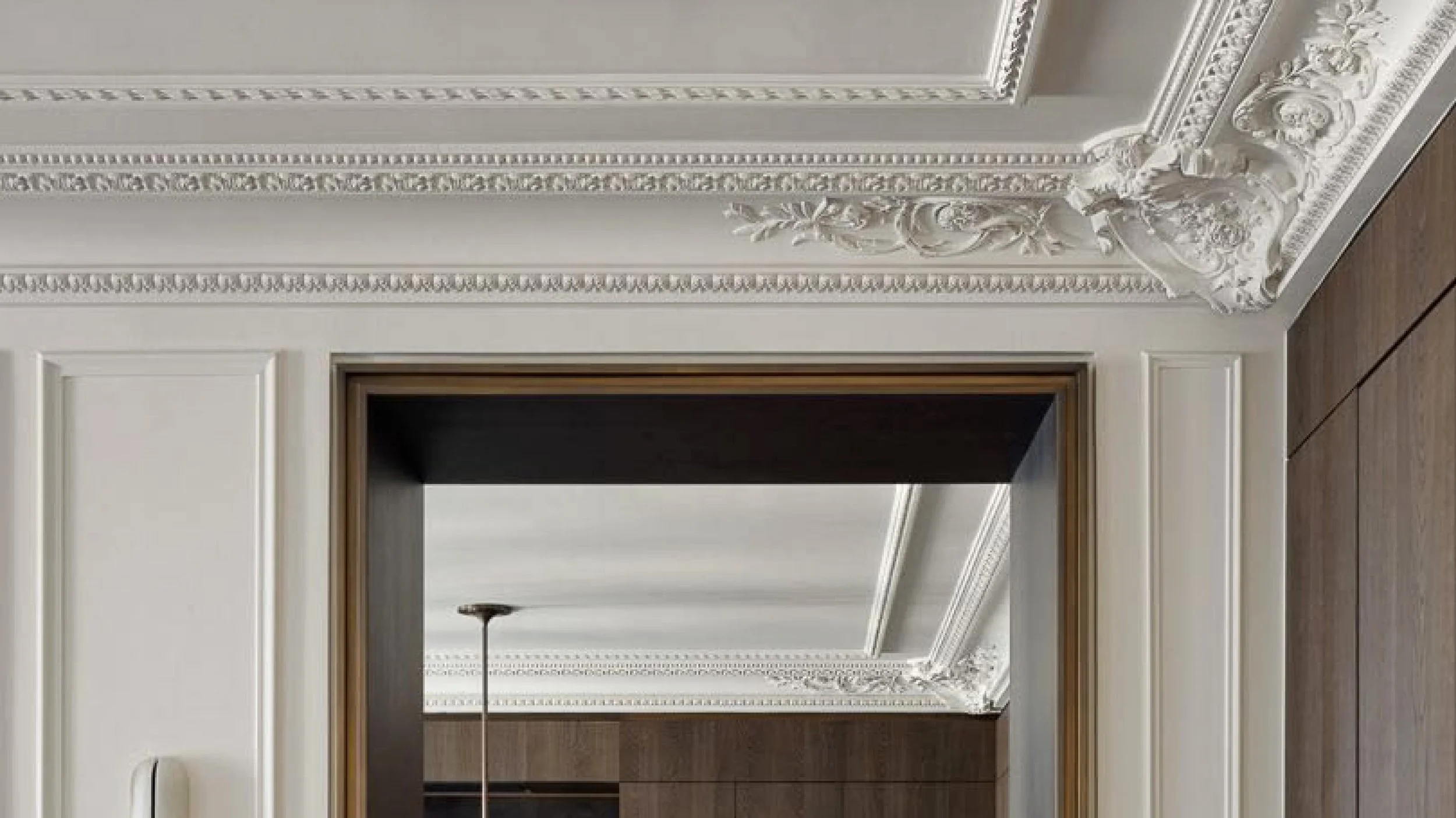 Ornate cornice molding brings timeless craftsmanship and architectural elegance to the ceiling.