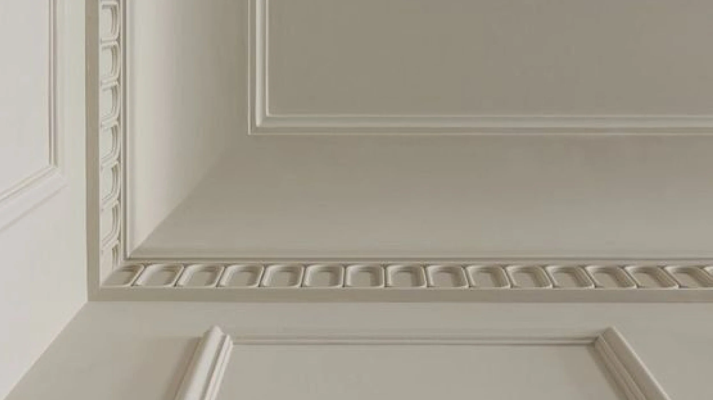 Thoughtfully layered ceiling molding transforms the fifth wall into a statement of architectural elegance.
