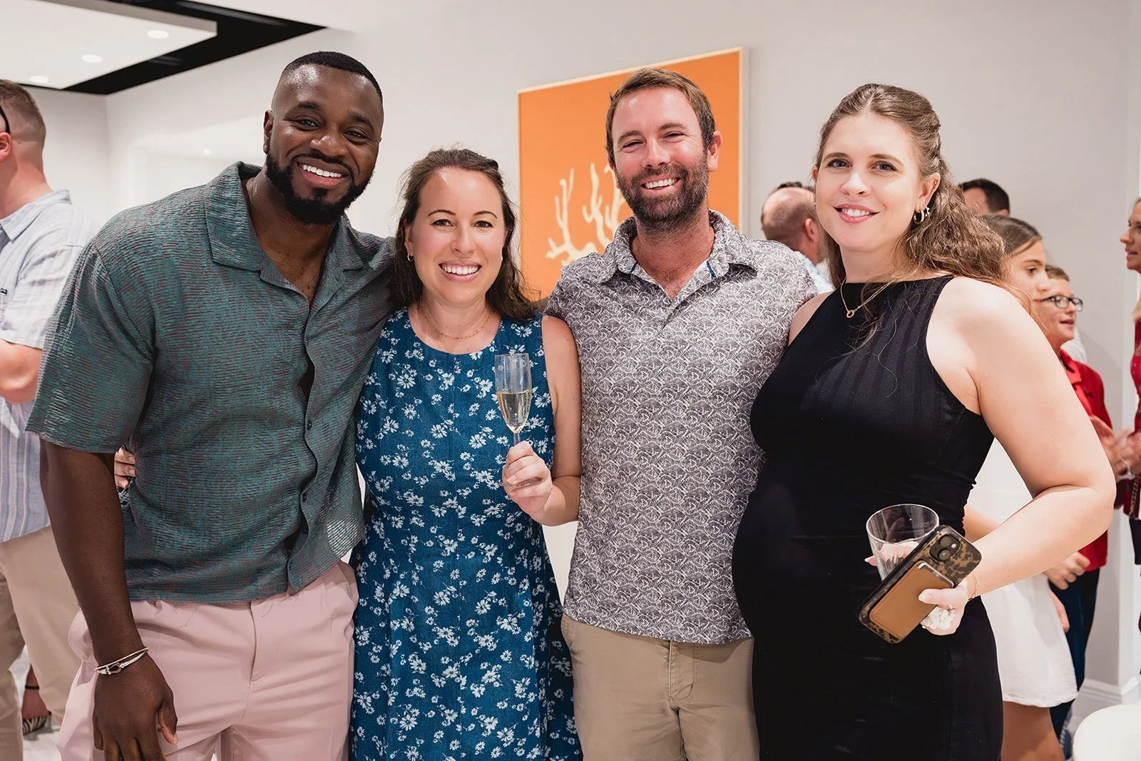 Guests with artist Josie Frazer at IDG's exhibition "Spatial Dialogue" during Cayman Art Week 2026.