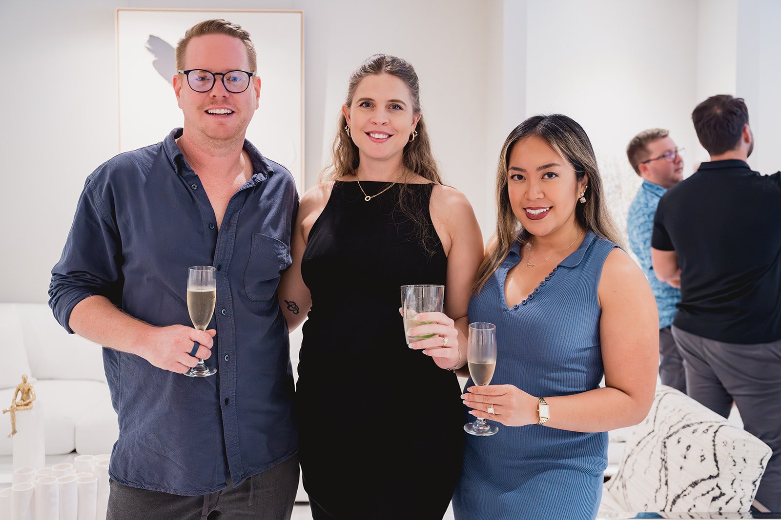 Guests with artist Josie Frazer at IDG's exhibition "Spatial Dialogue" during Cayman Art Week 2026.
