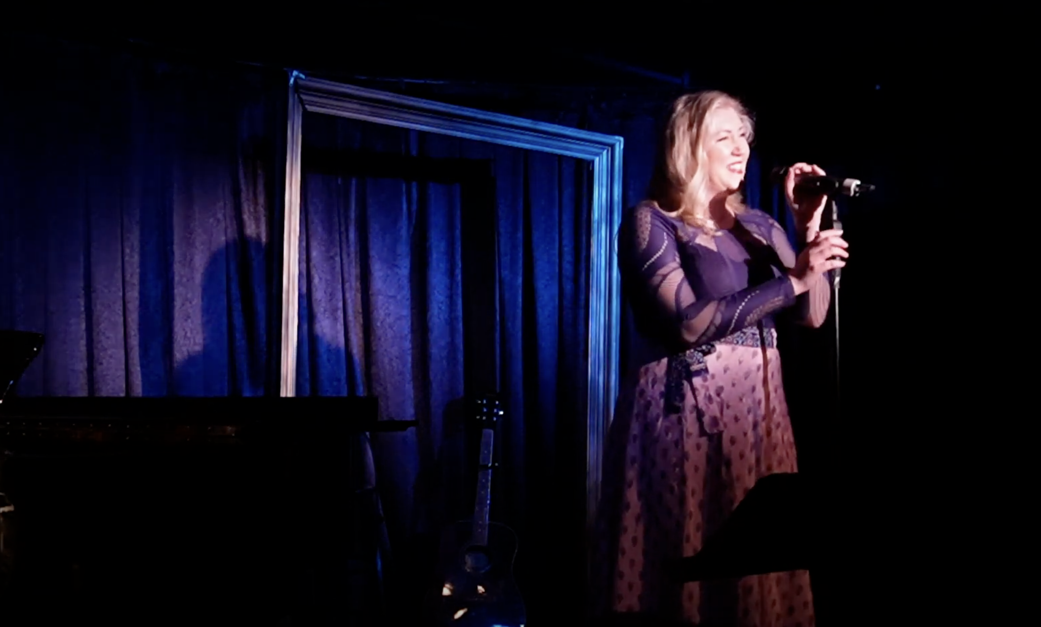 Kim performing at Don't Tell Mama in NYC