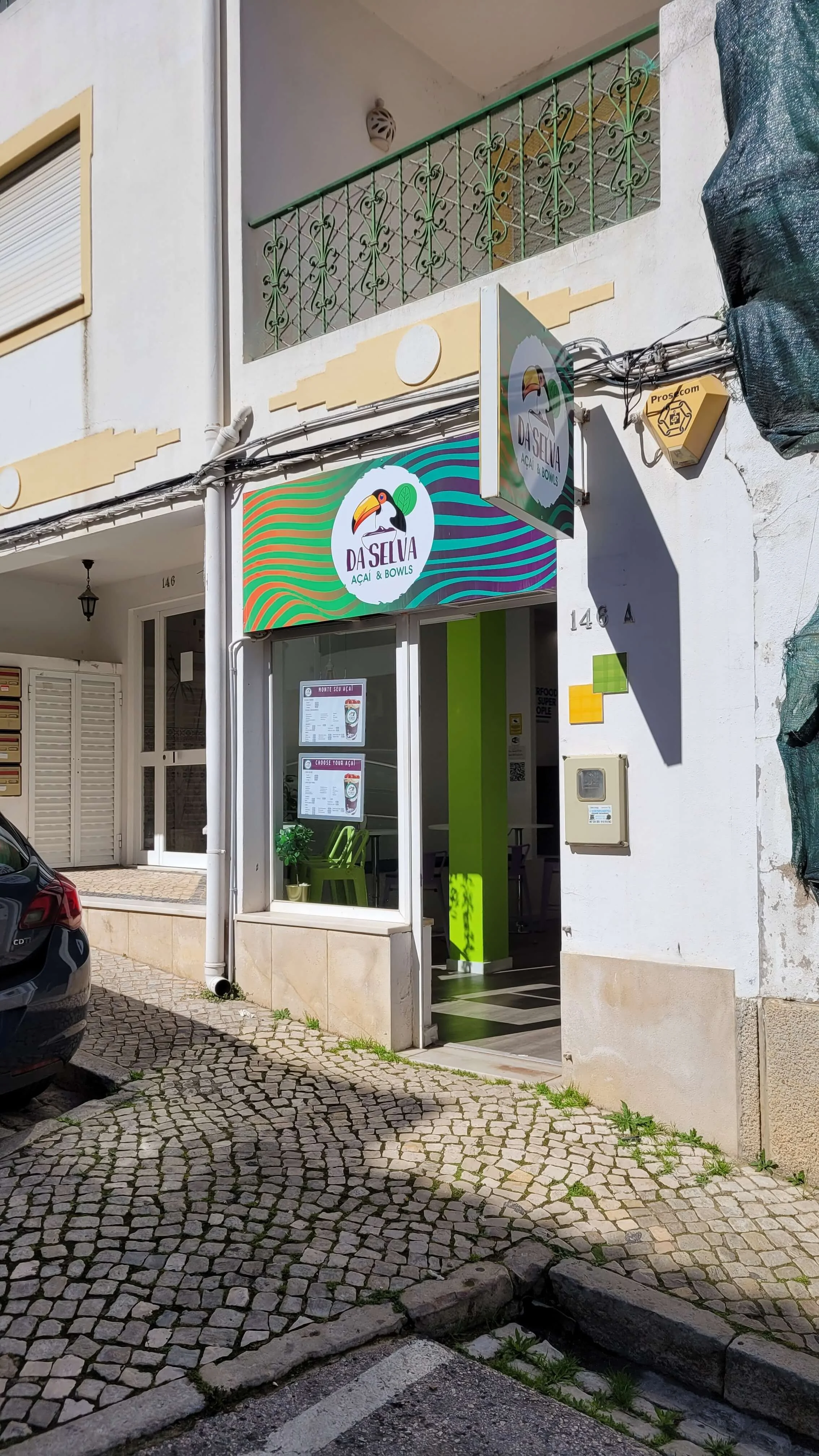 Entrance to Da Selva Acai and Bowls shop in Lagos Algarve with menu displayed