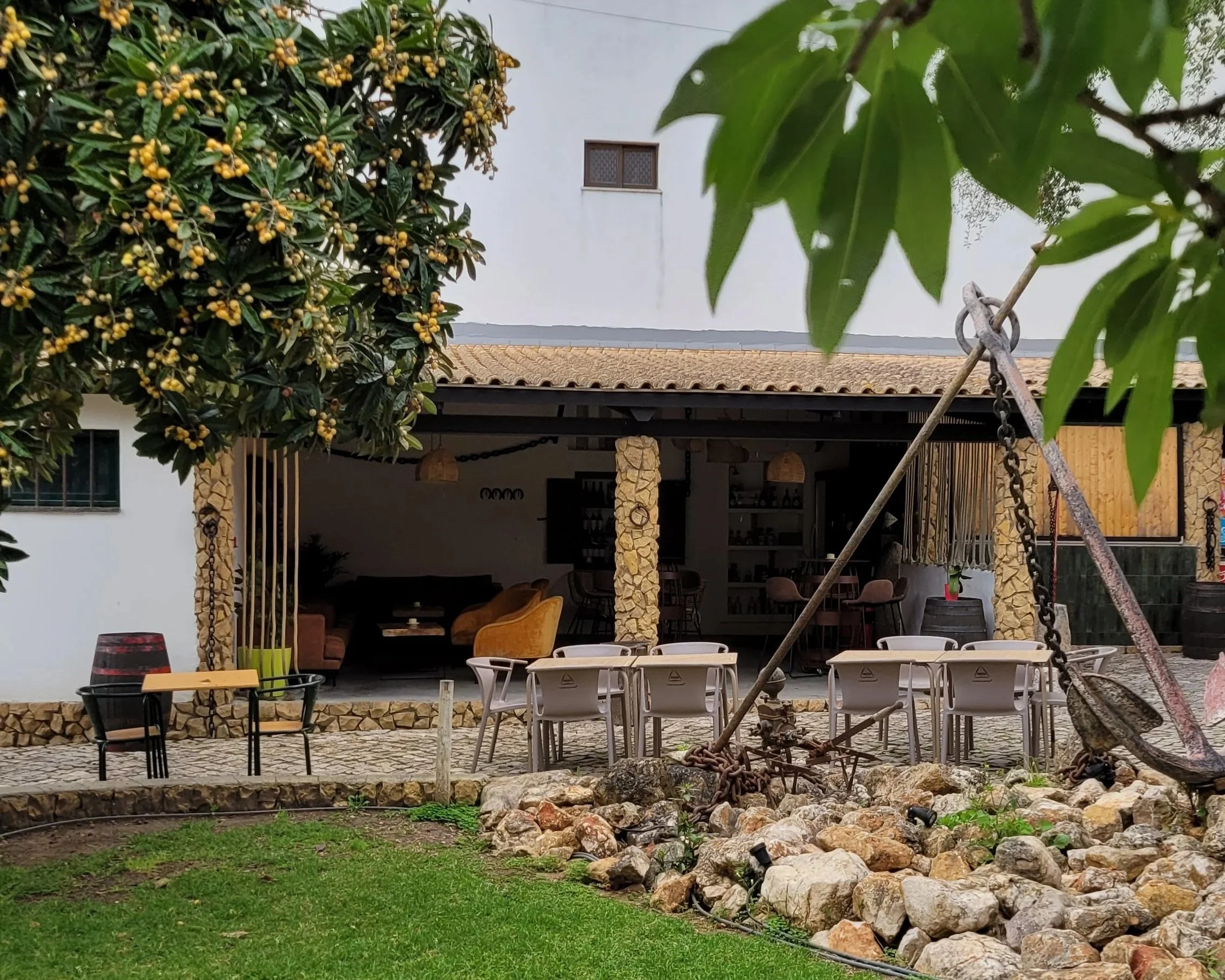 Green garden and outdoor terrace at Casa Chico Ze farm restaurant near Lagos