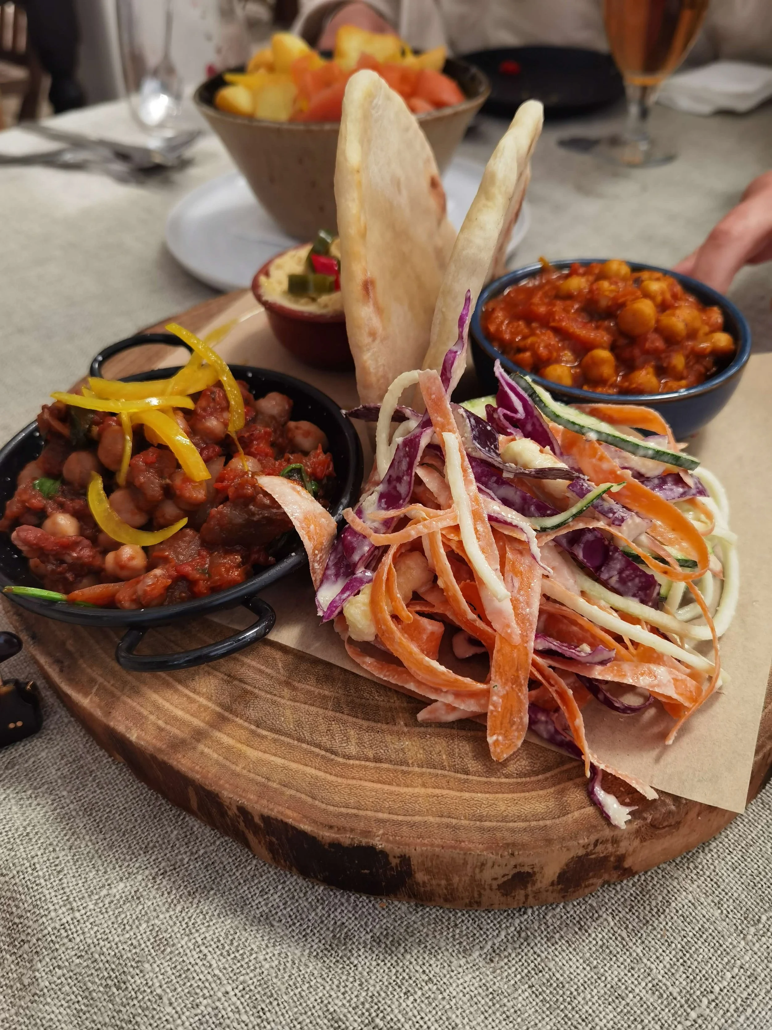 Plant-based sharing platter with chickpeas flatbread and fresh salad at Sunrays Kitchen Lagos