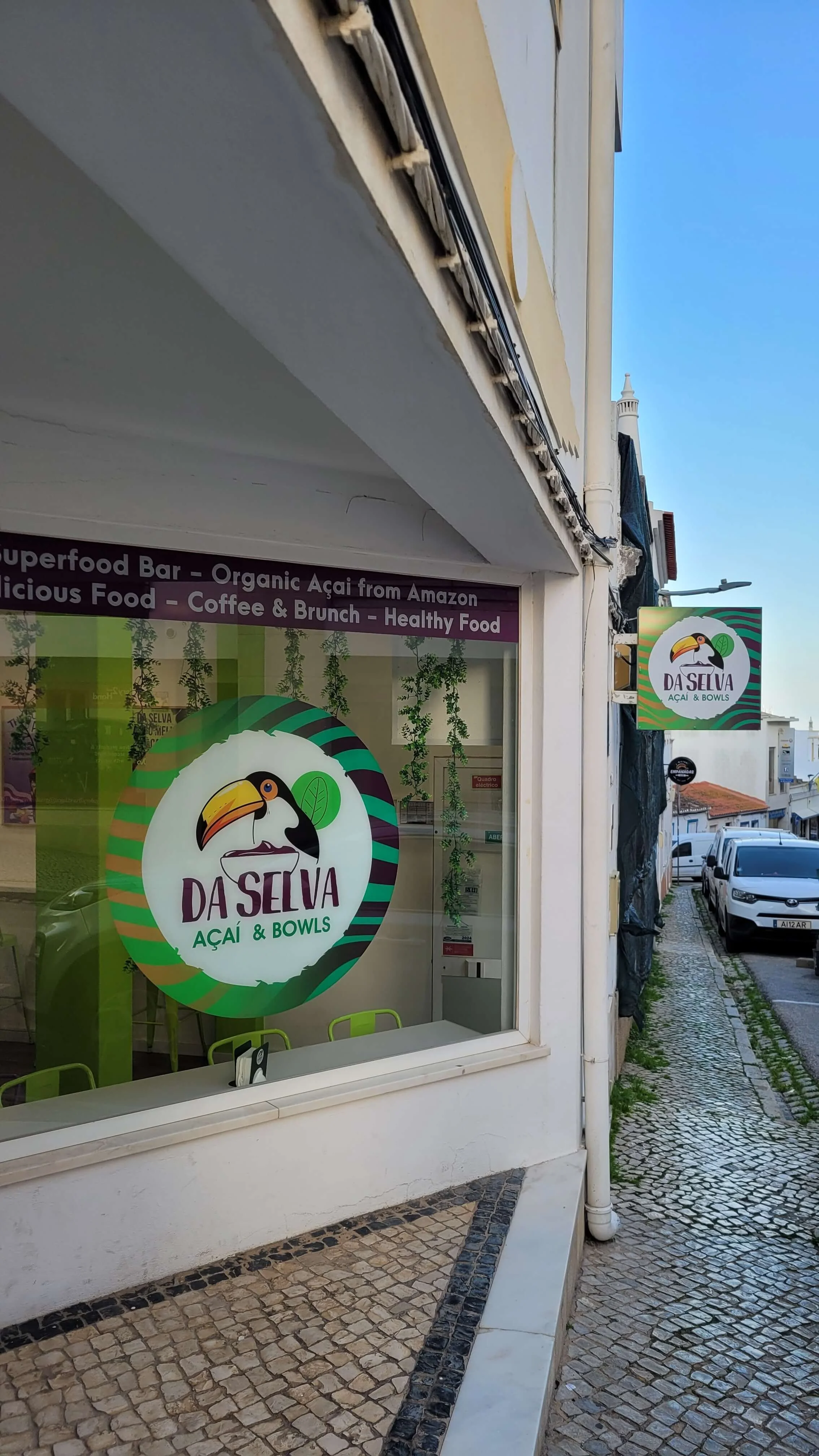 Da Selva Acai and Bowls shopfront on a cobblestone street in Lagos old town
