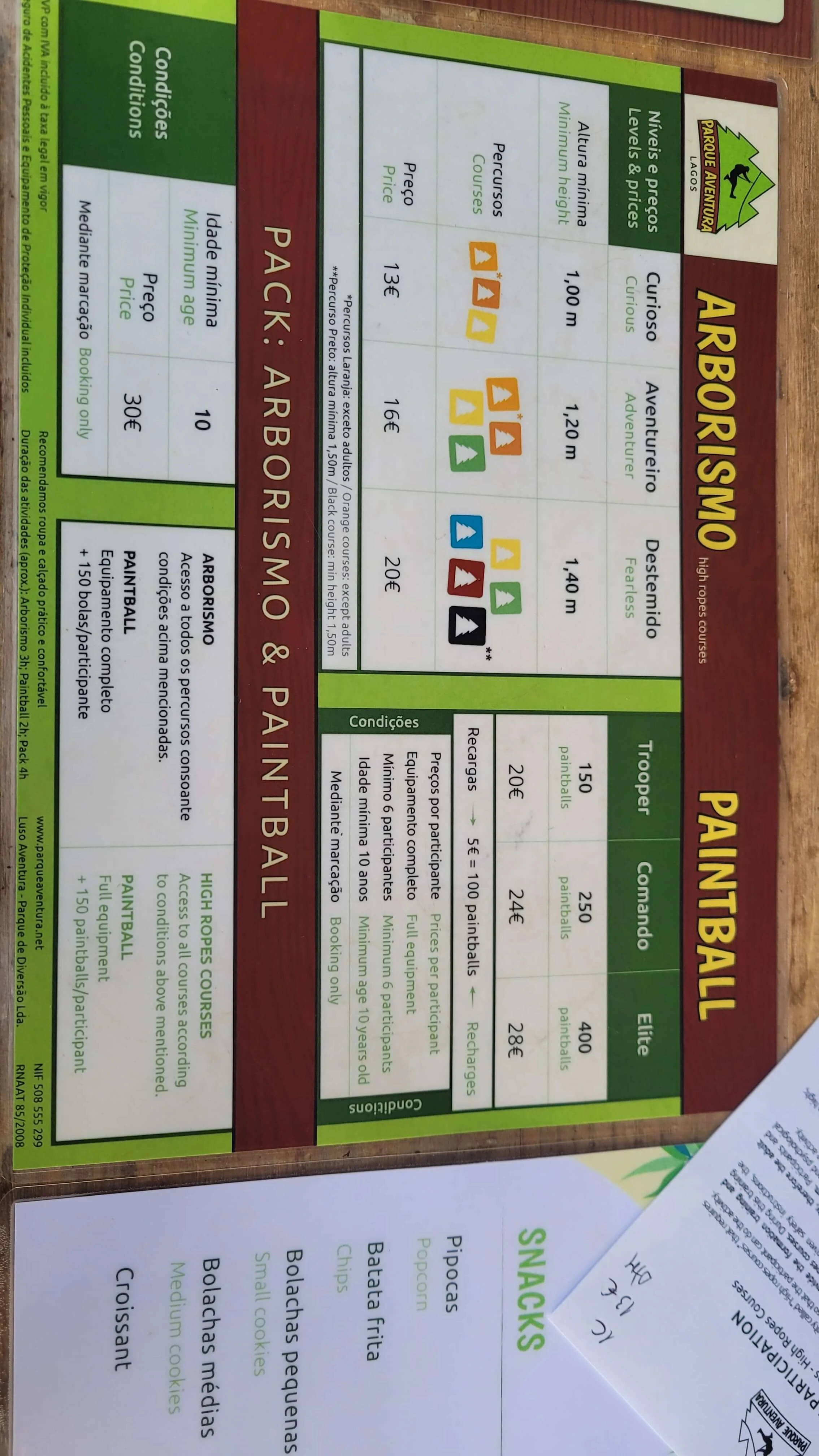 Price board showing climbing courses and paintball options at Parque Aventura Lagos